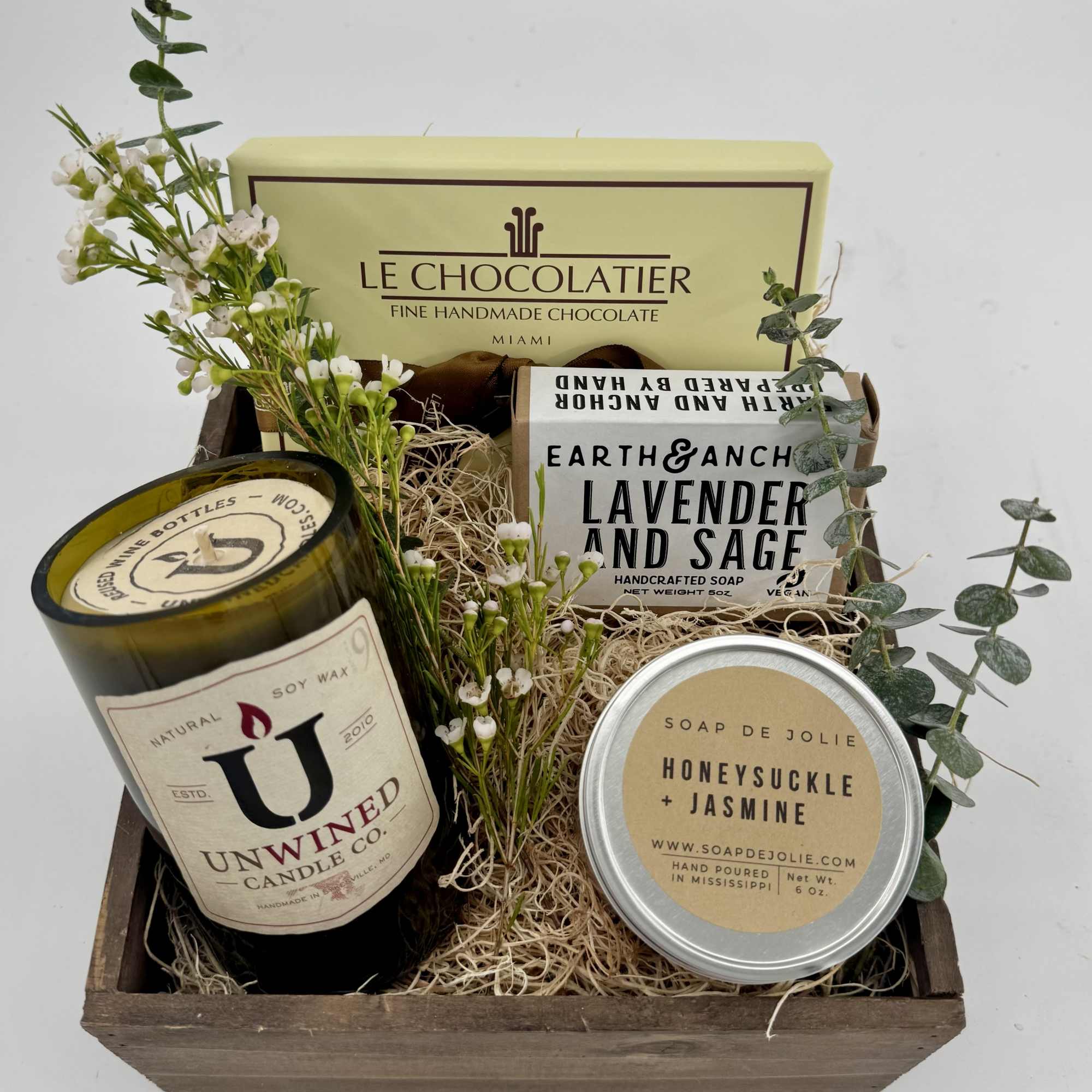Gift basket with candles, soaps, chocolates, and small white flowers, photo 2 of 2