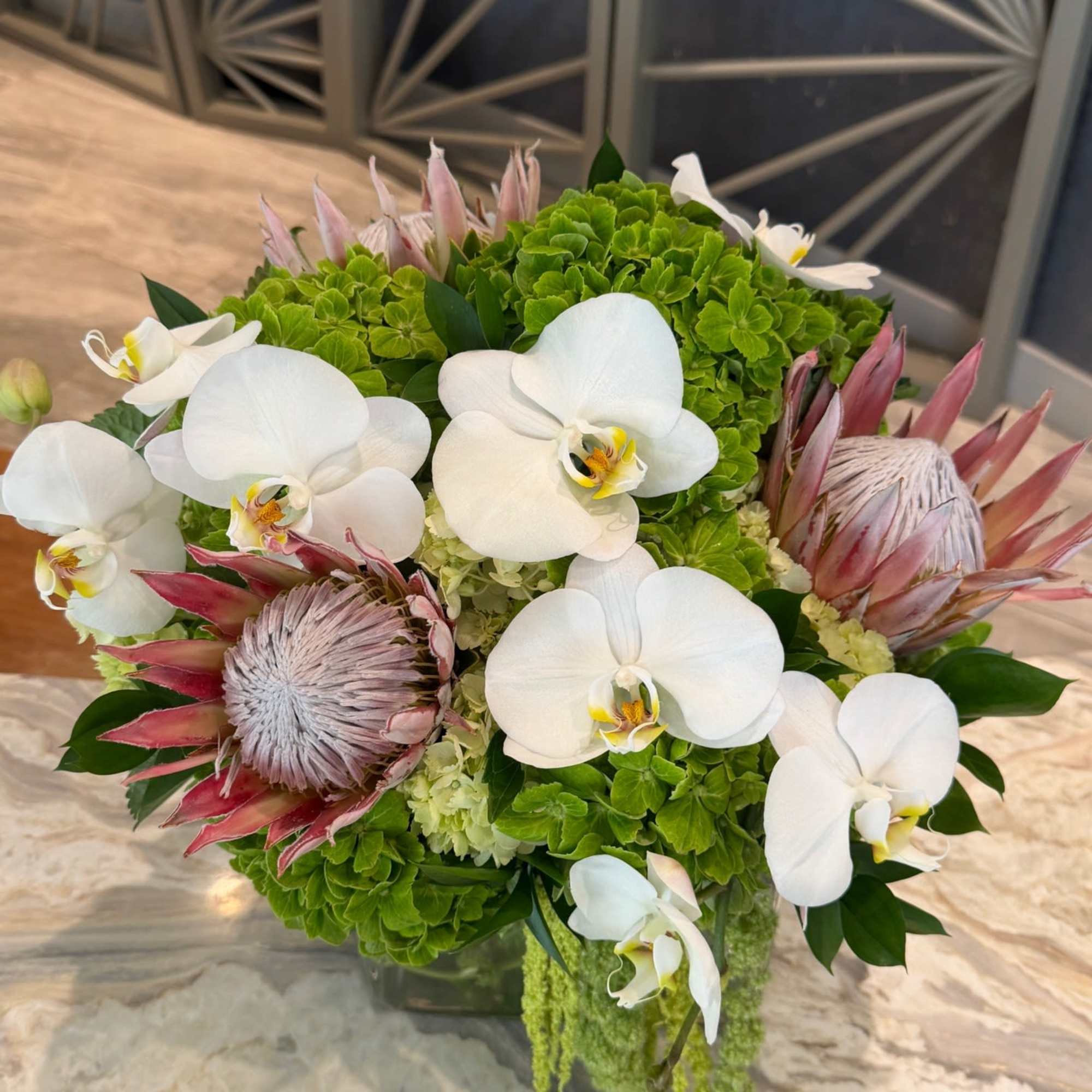 A bold and elevated design, this arrangement features elegant white phalaenopsis orchids, photo 3 of 4