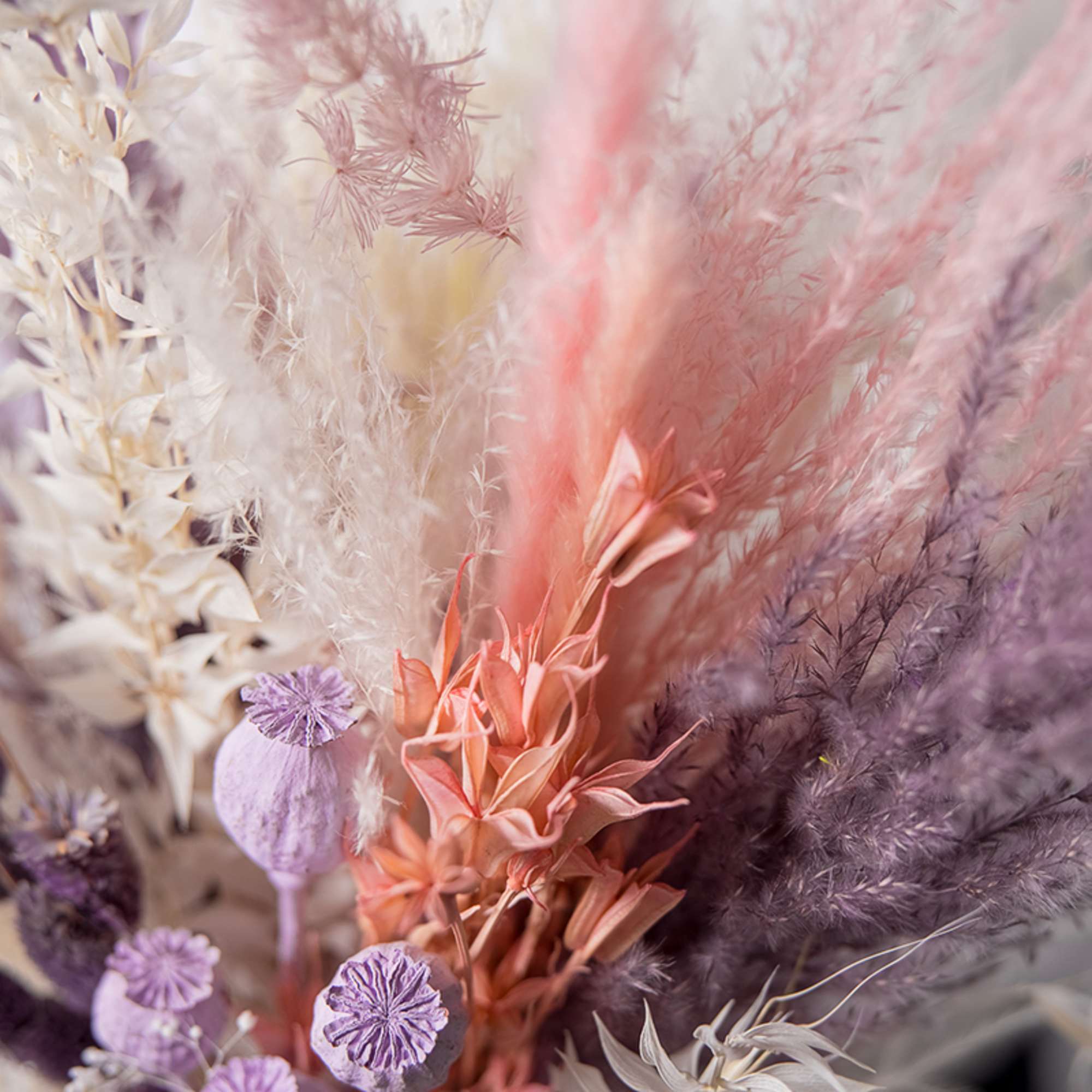 Pastel dried floral arrangement with pink, lavender, and cream textures