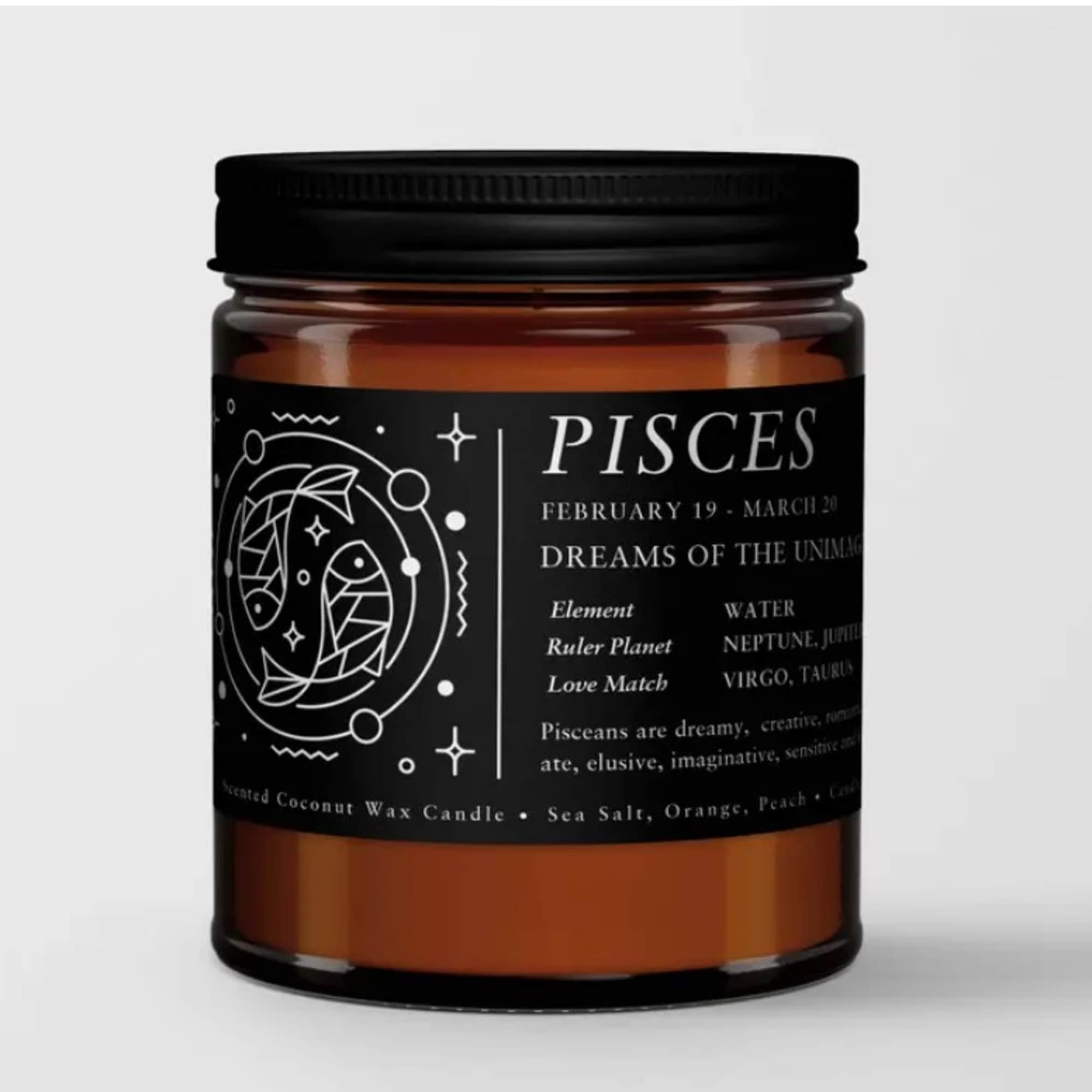 Amber candle in a black-lidded jar with a Pisces label