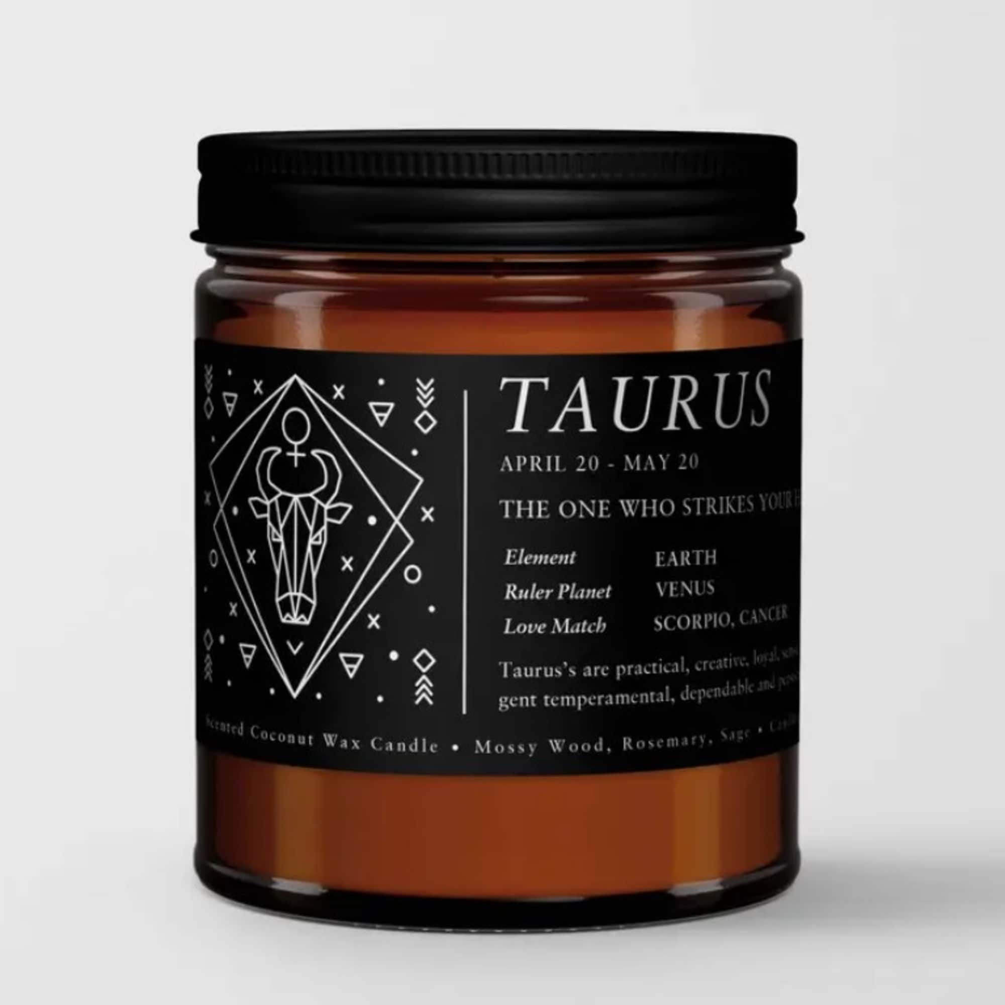 Amber jar candle with a black Taurus label