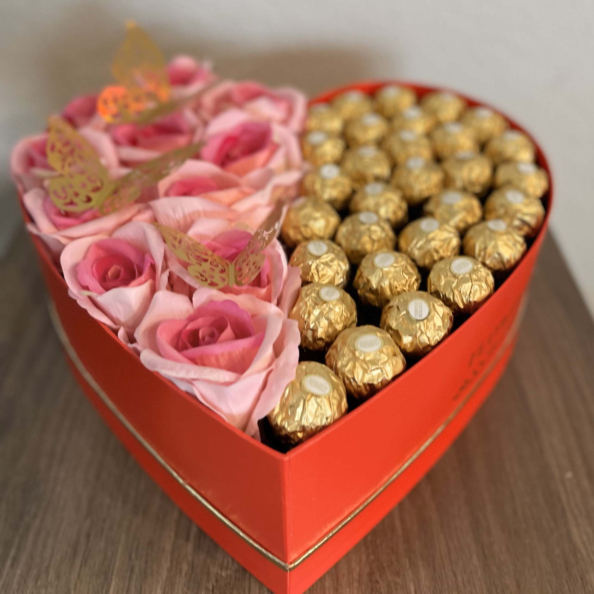 Heart-shaped box with pink roses and gold-wrapped chocolates, photo 2 of 2