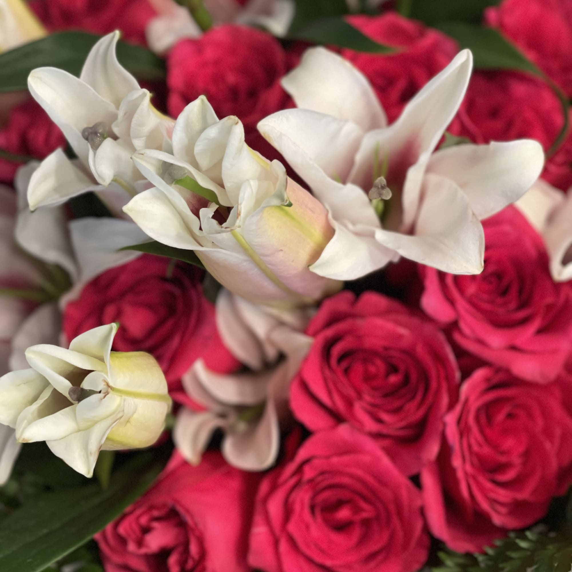 Bouquet of hot pink roses and white lilies