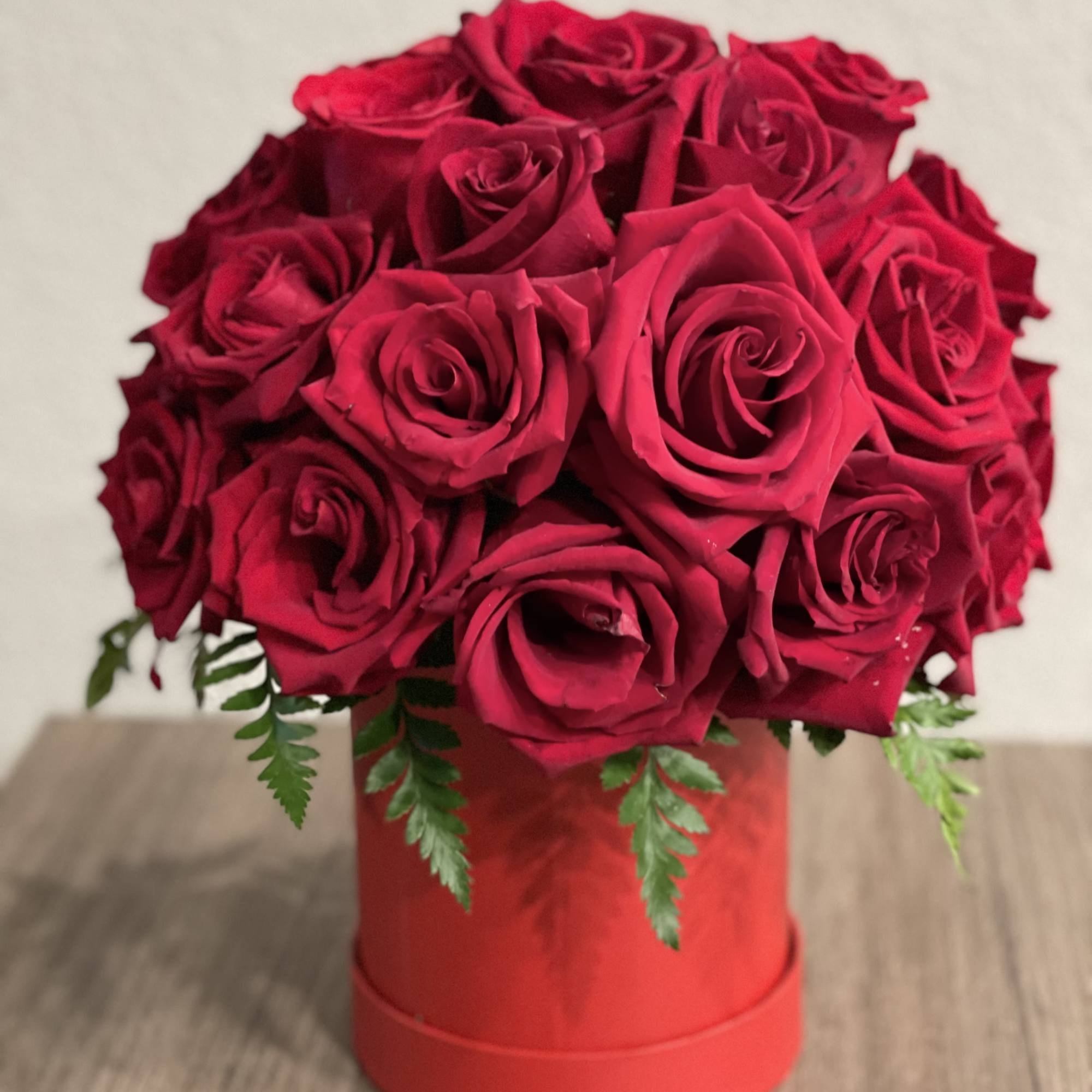 Red rose bouquet in a red hat box