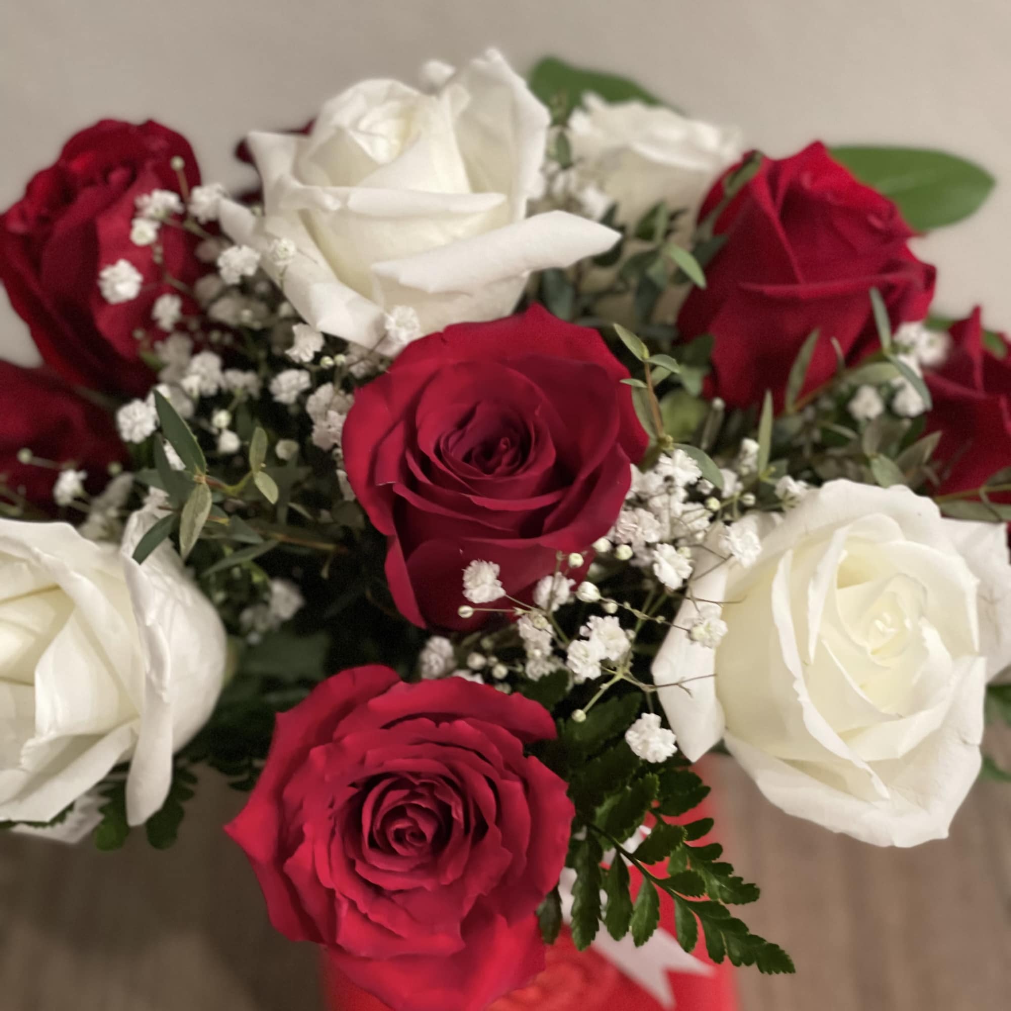 Bouquet of red and white roses with baby's breath