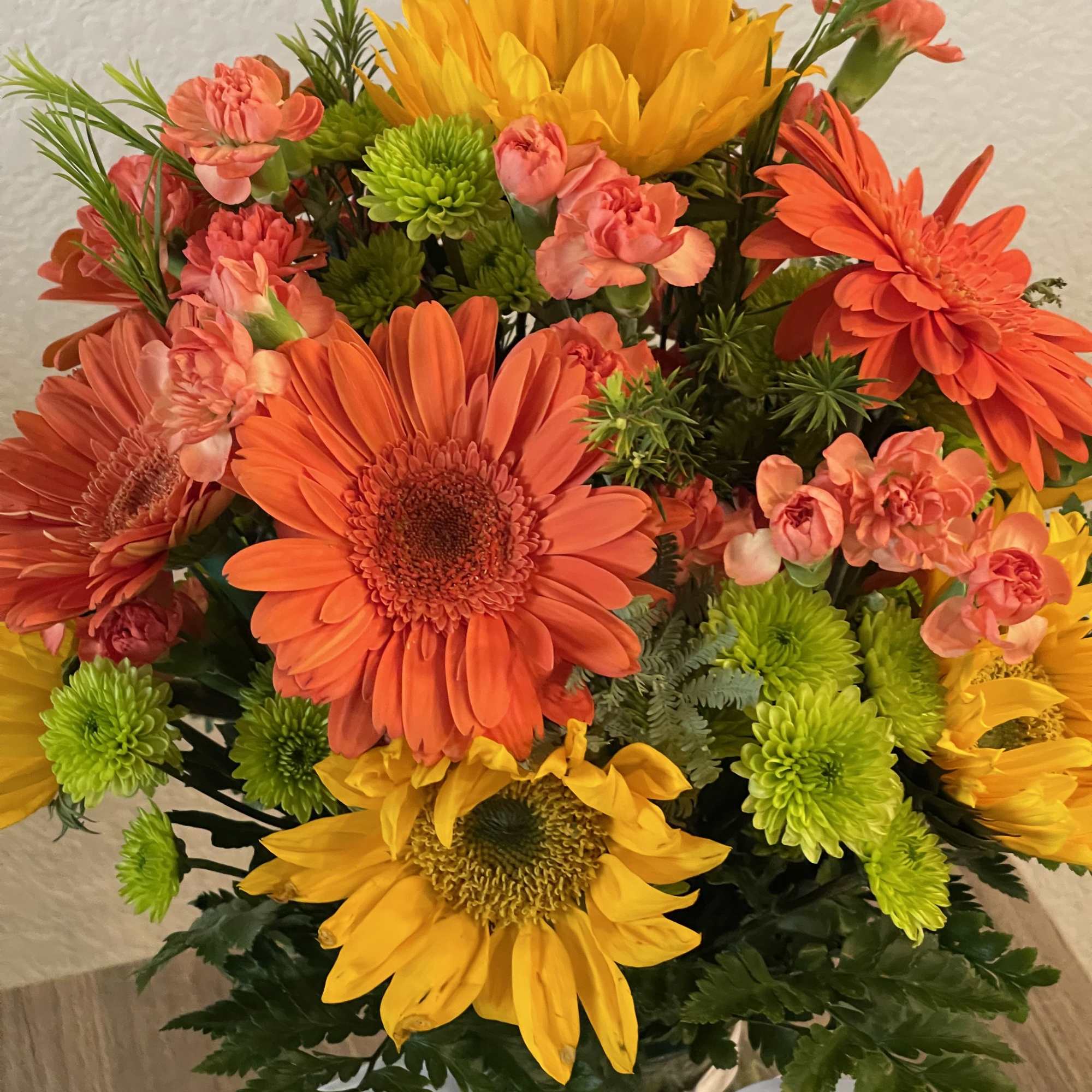 Elegant bouquet of long stem orange roses with assorted greenery all around, photo 2 of 2