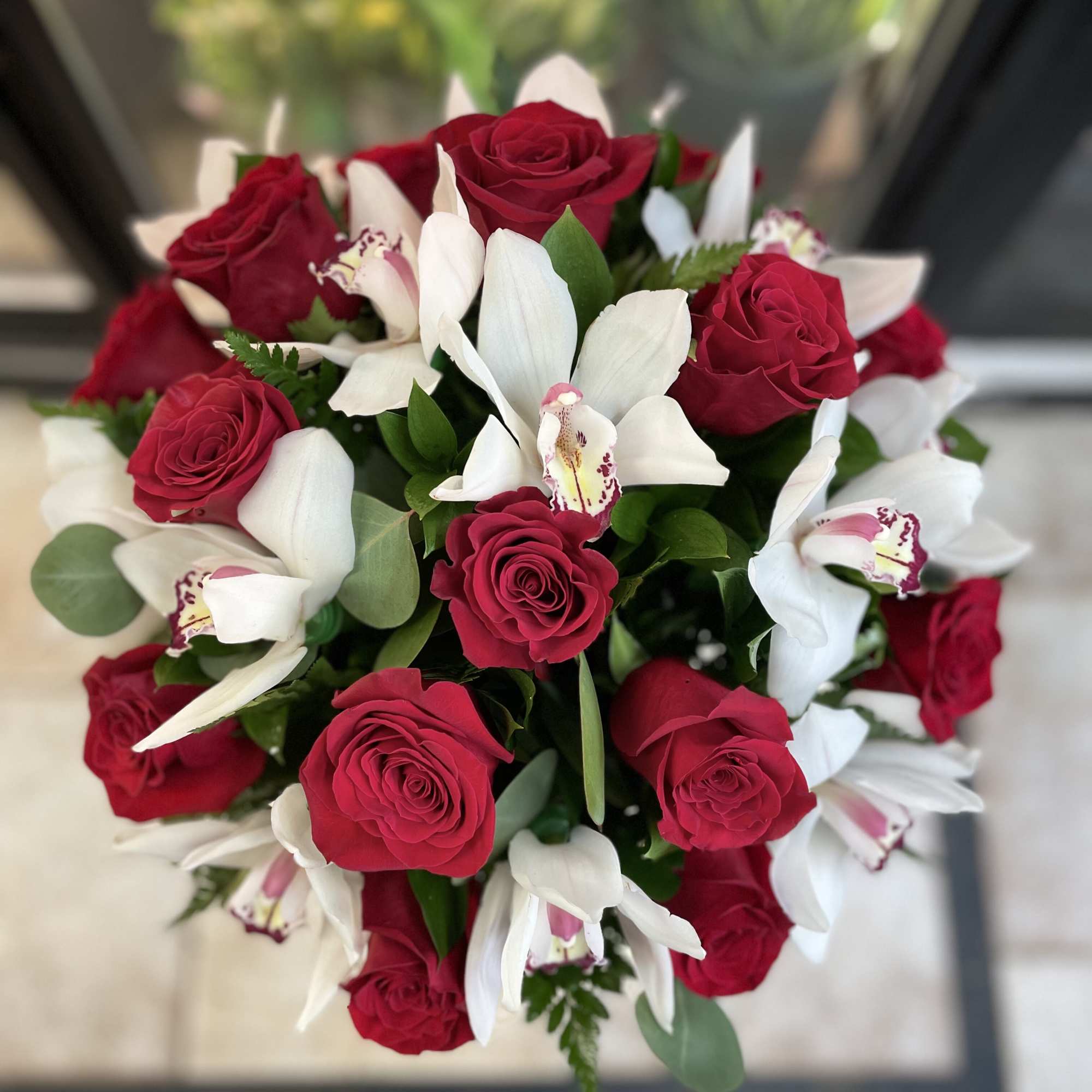 Bouquet of red roses and white orchids