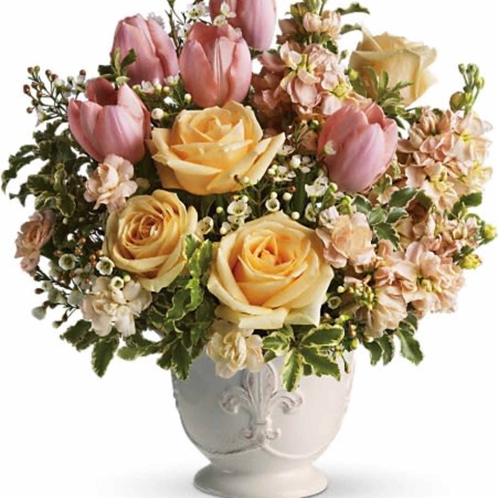 Pink tulips and yellow roses arranged in a white vase