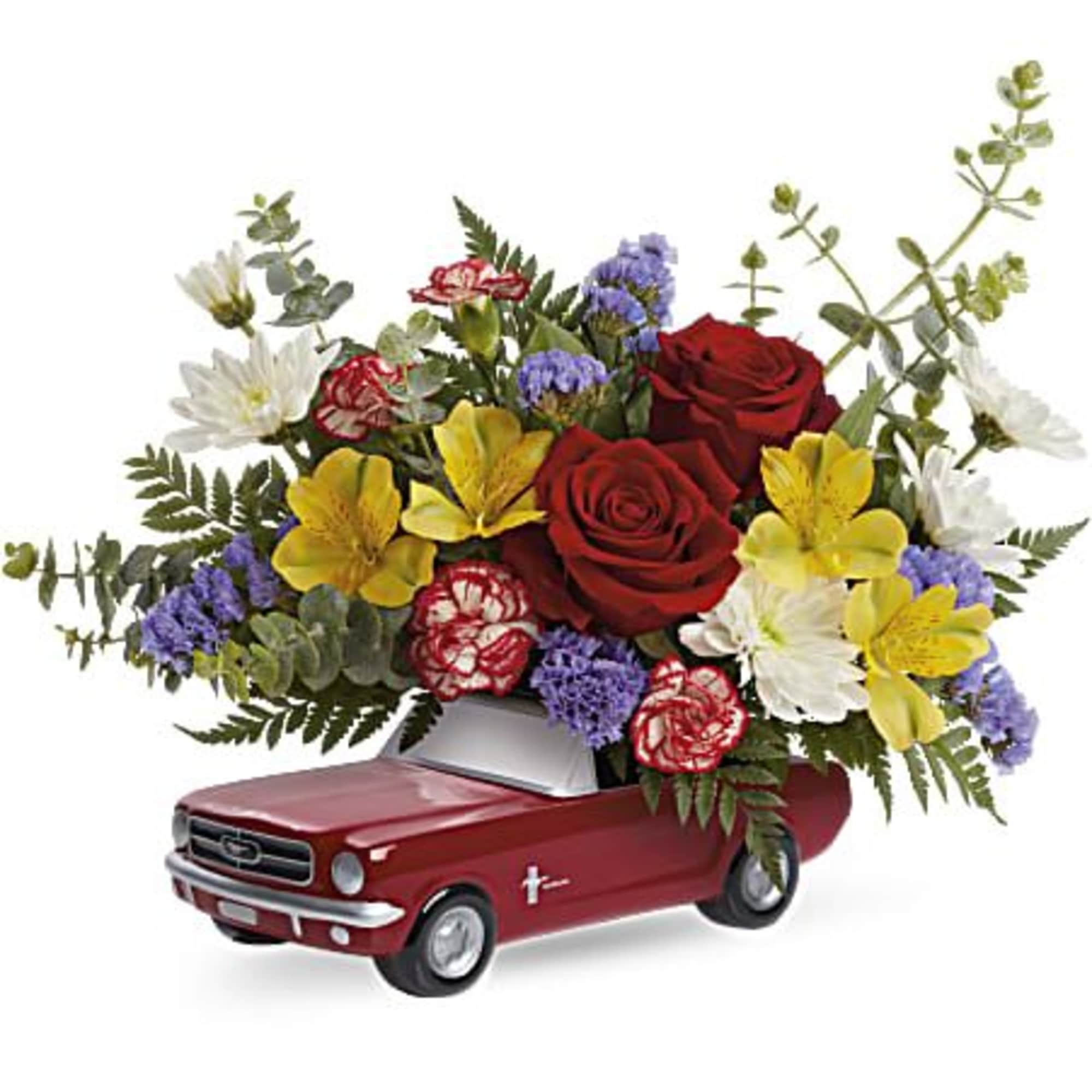 Flower arrangement in a red pickup truck container