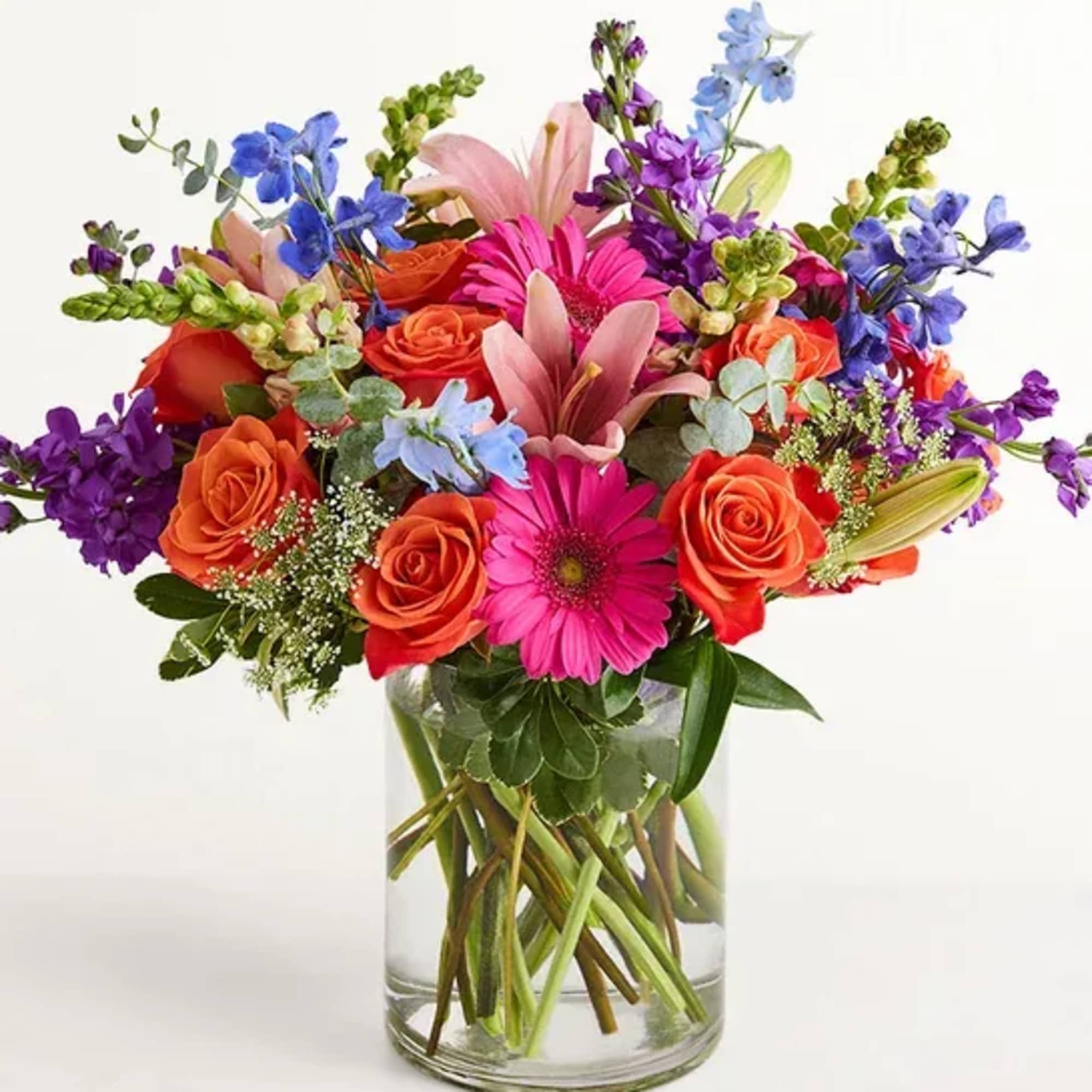 A fresh-from-the-meadow design makes this colorful bouquet a true delight. Orange roses