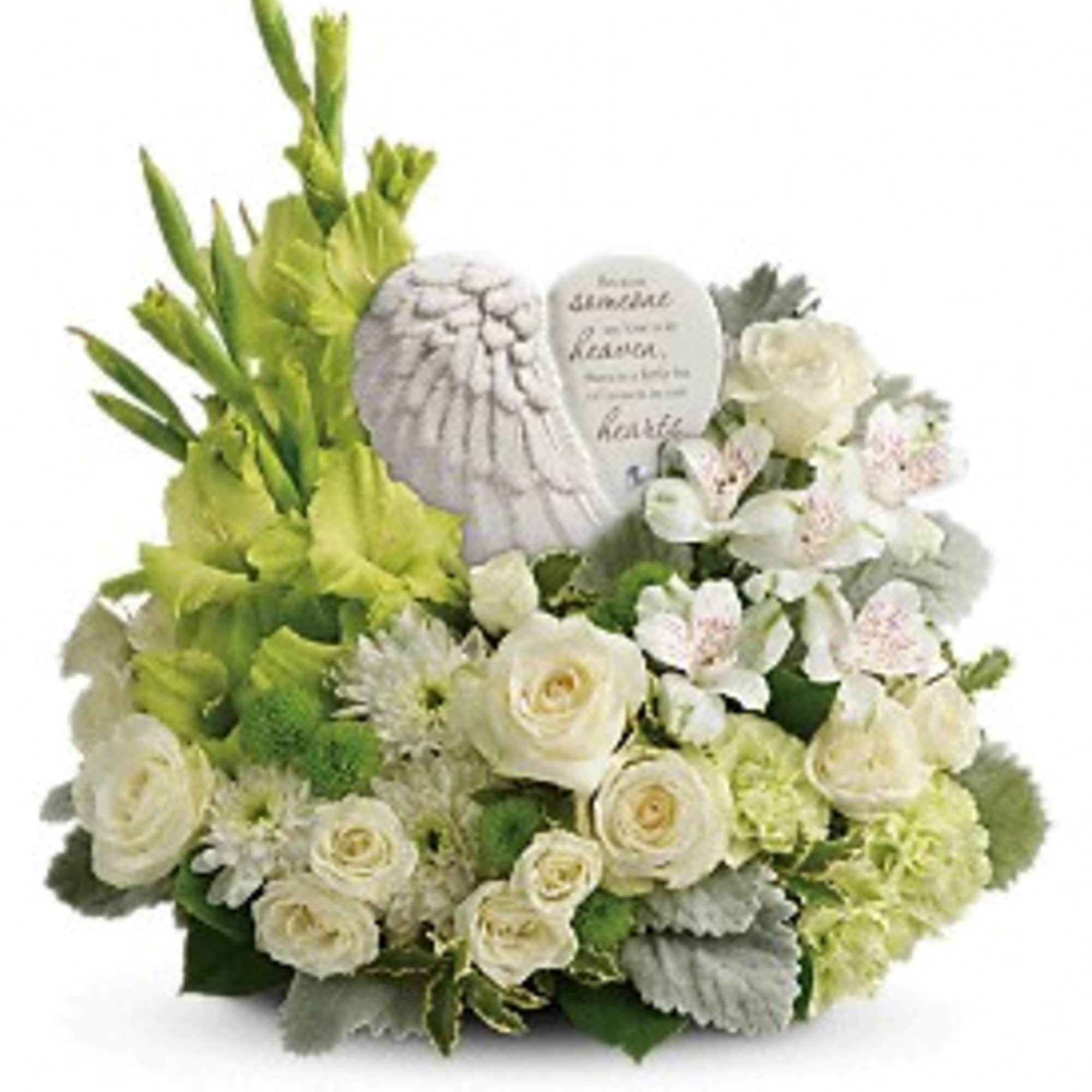 White floral arrangement with a memorial stone and green gladiolus