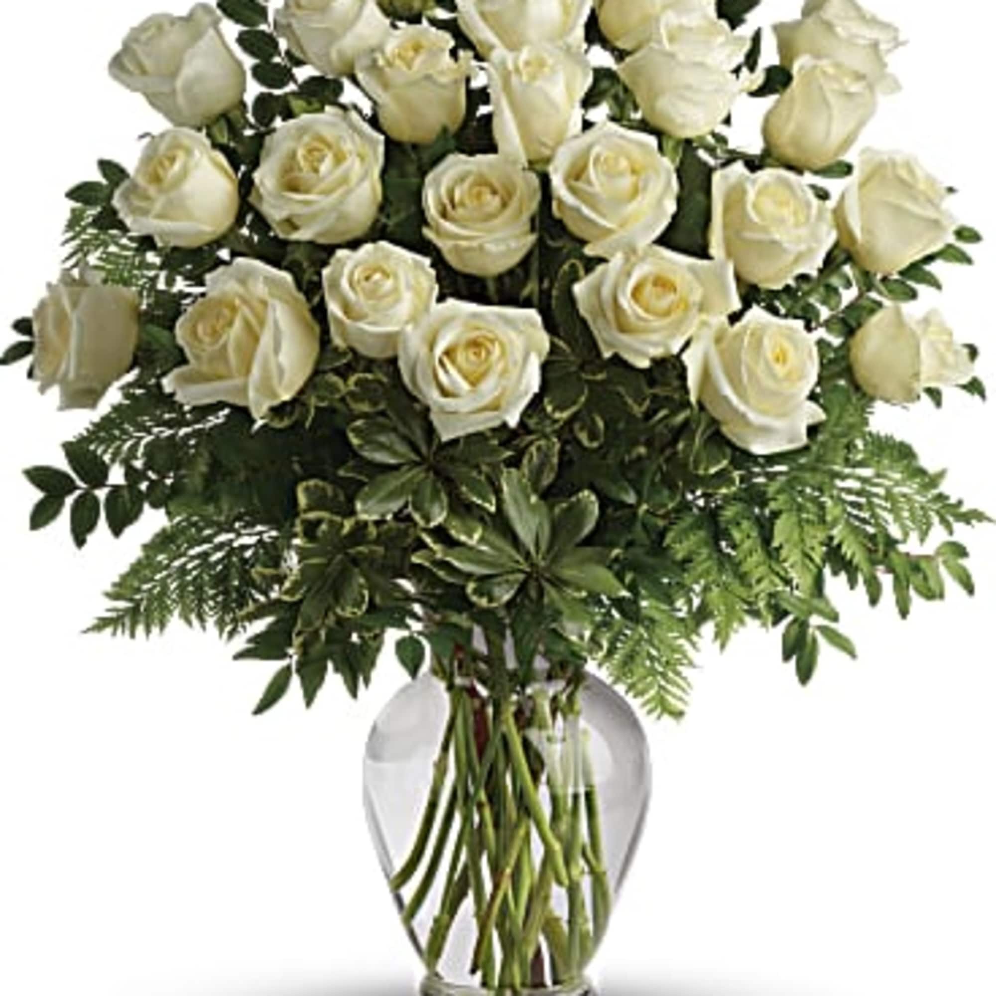 Bouquet of white roses in a clear glass vase