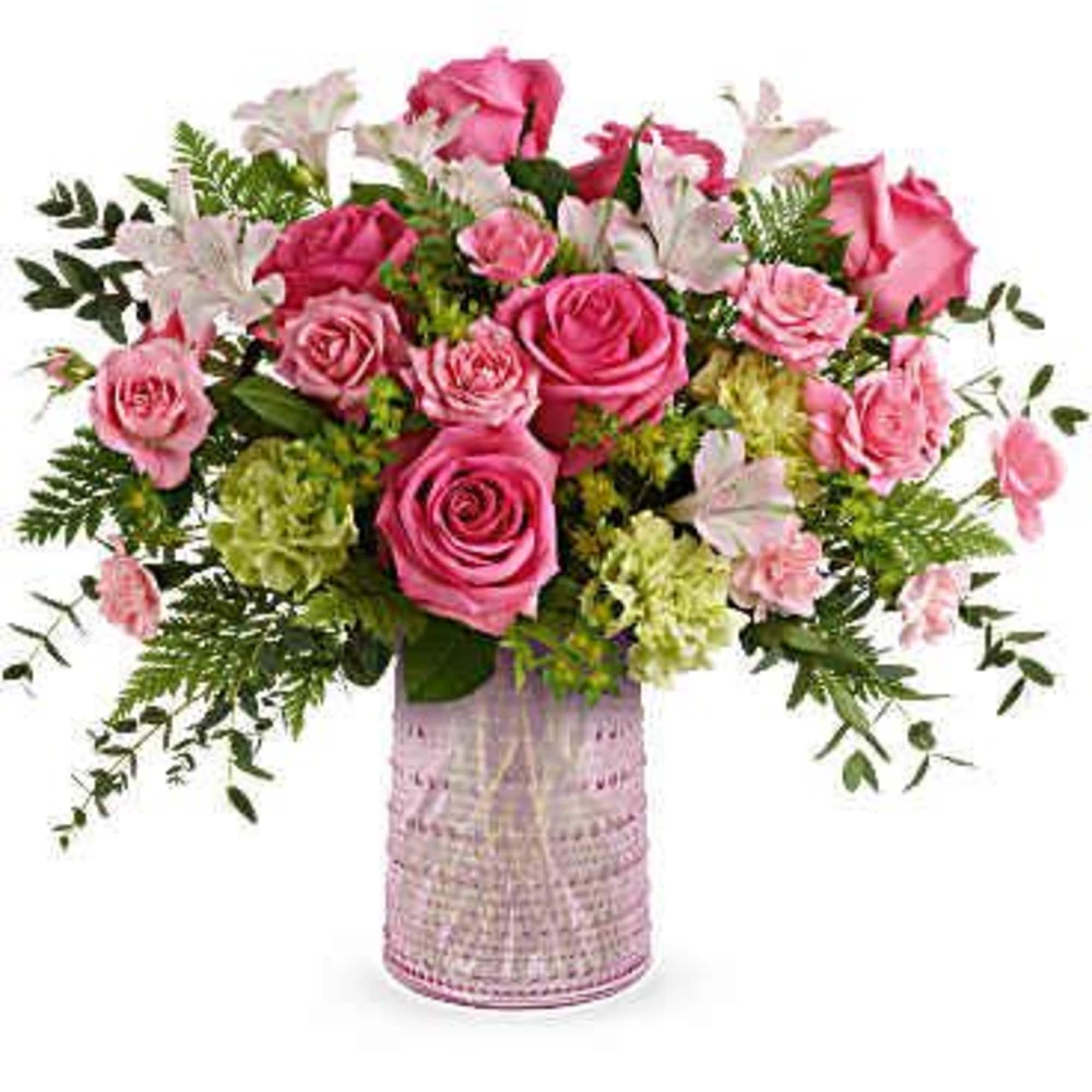 Pink roses and white lilies in a pink textured vase