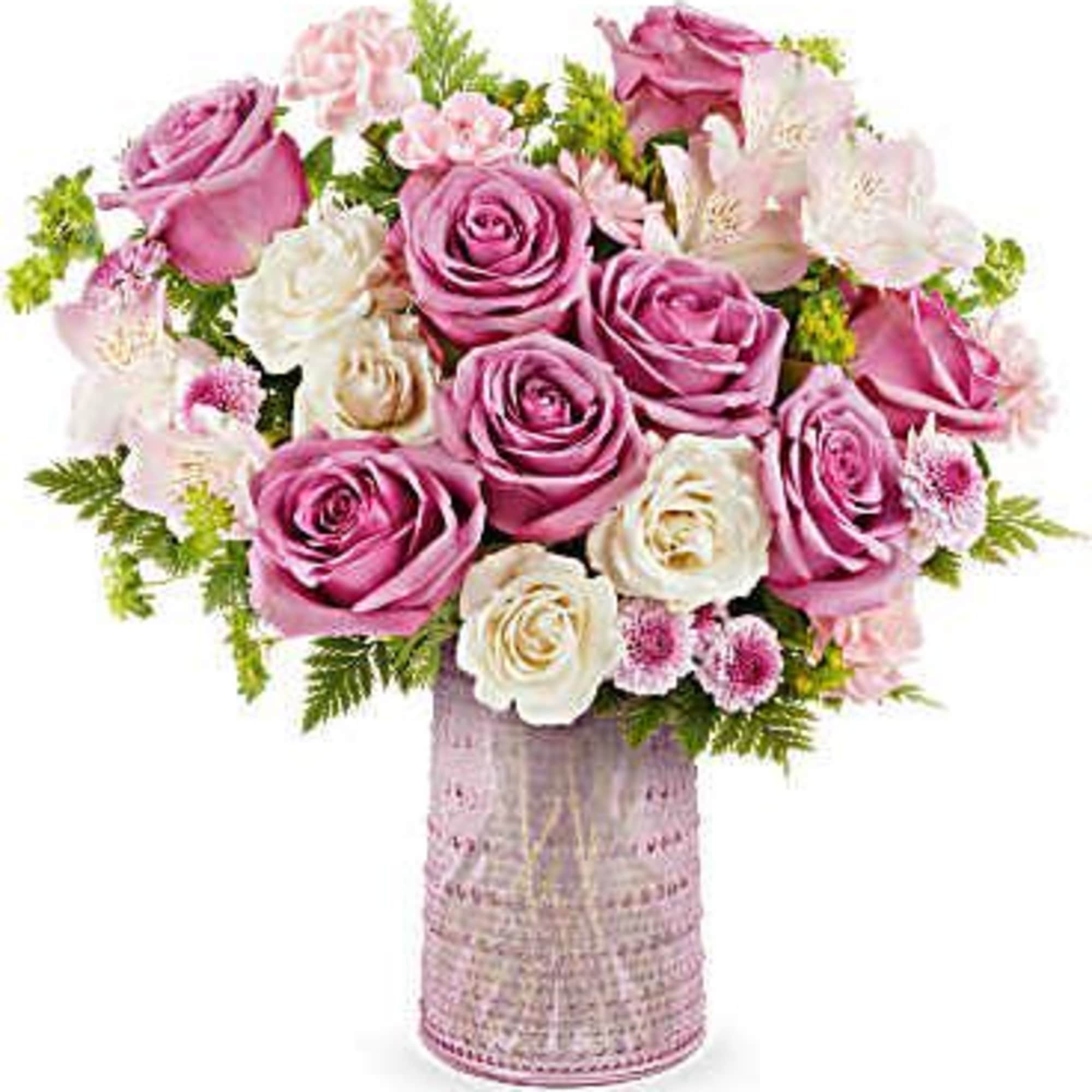 Pink and white rose bouquet in a textured pink vase