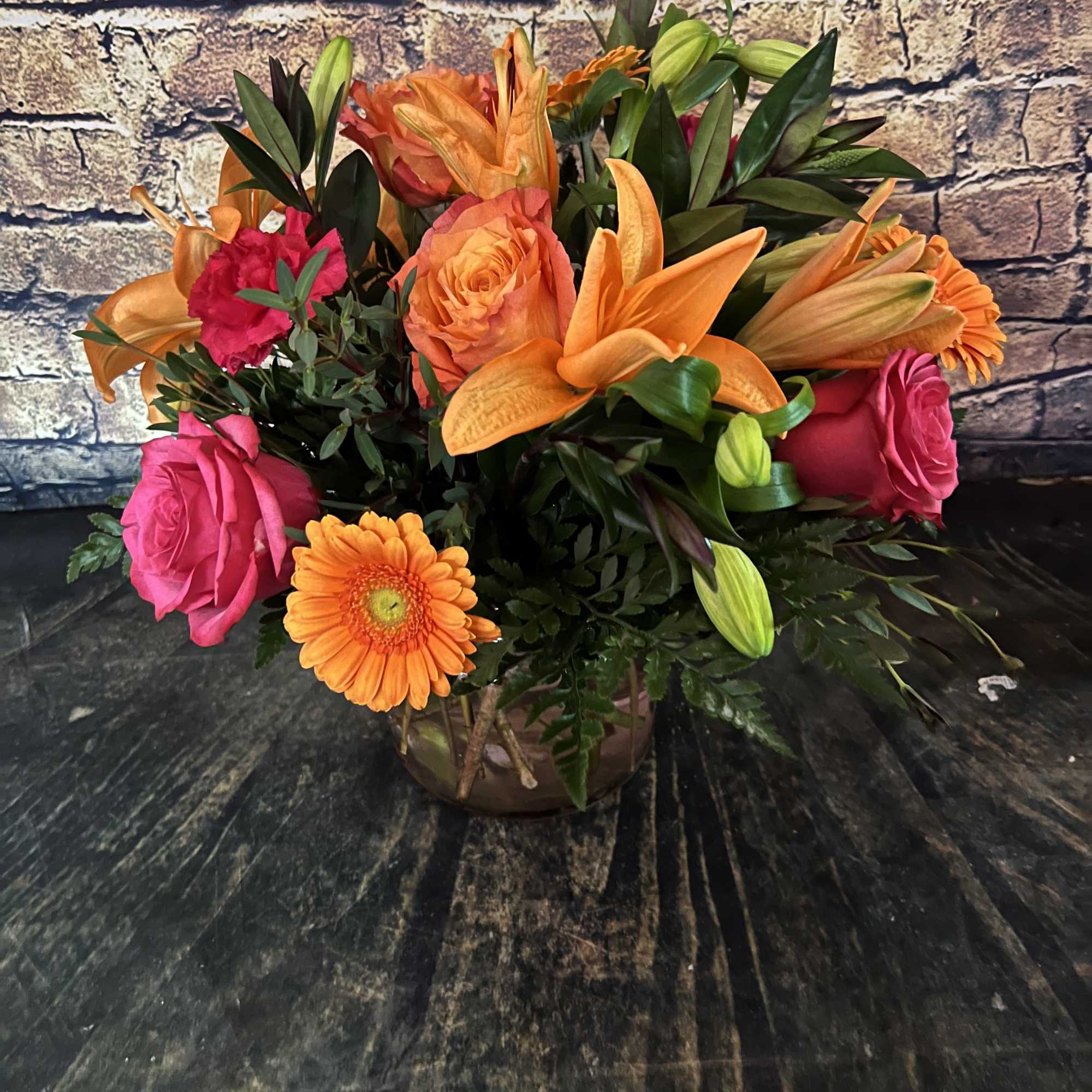Stunning roses, Gerbera daisies, lilies and carnations make a dazzling impression!