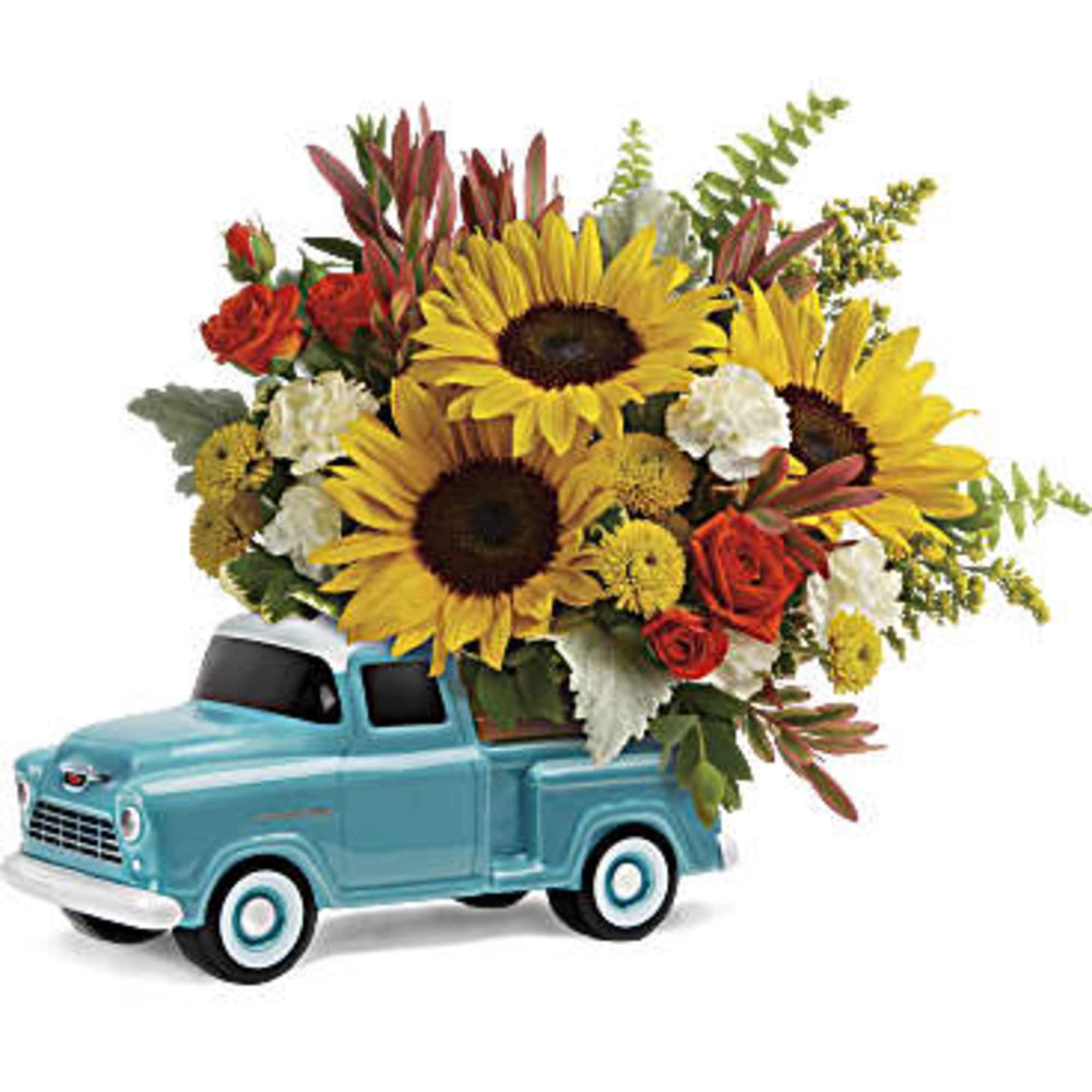 Sunflower bouquet arranged in a blue toy pickup truck