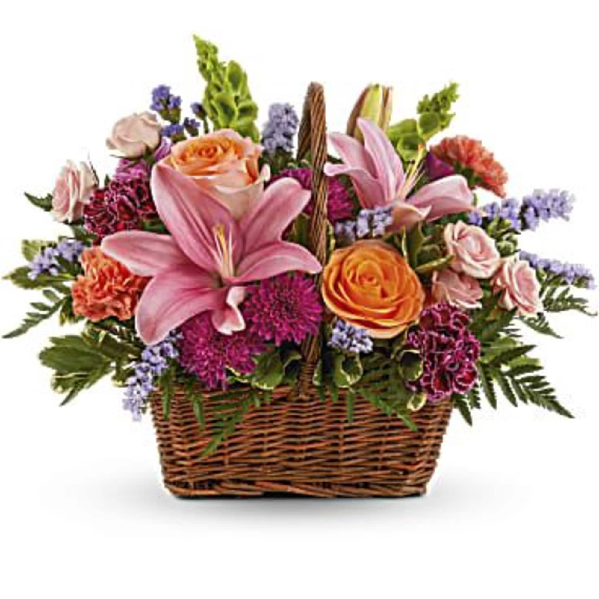 Basket of pink lilies, orange roses, and purple flowers