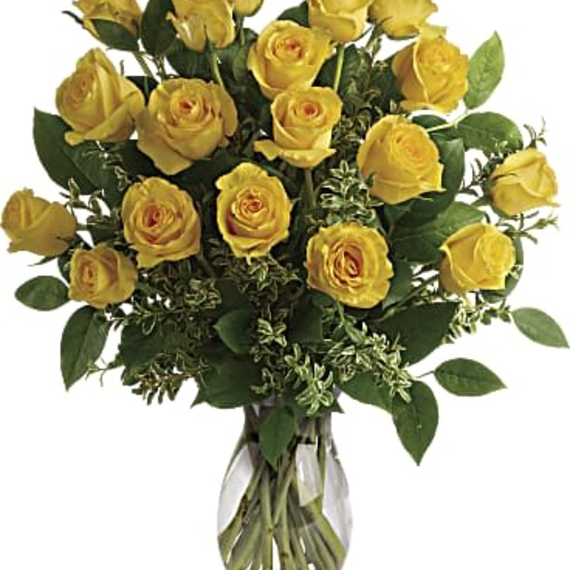 Yellow roses arranged in a clear glass vase