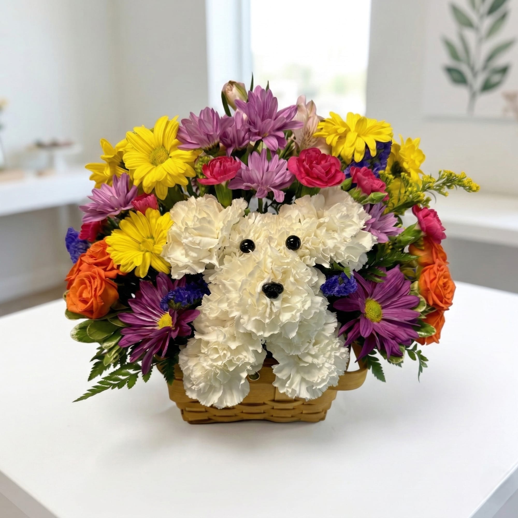 Basket arrangement with a white teddy bear made of flowers and colorful blooms