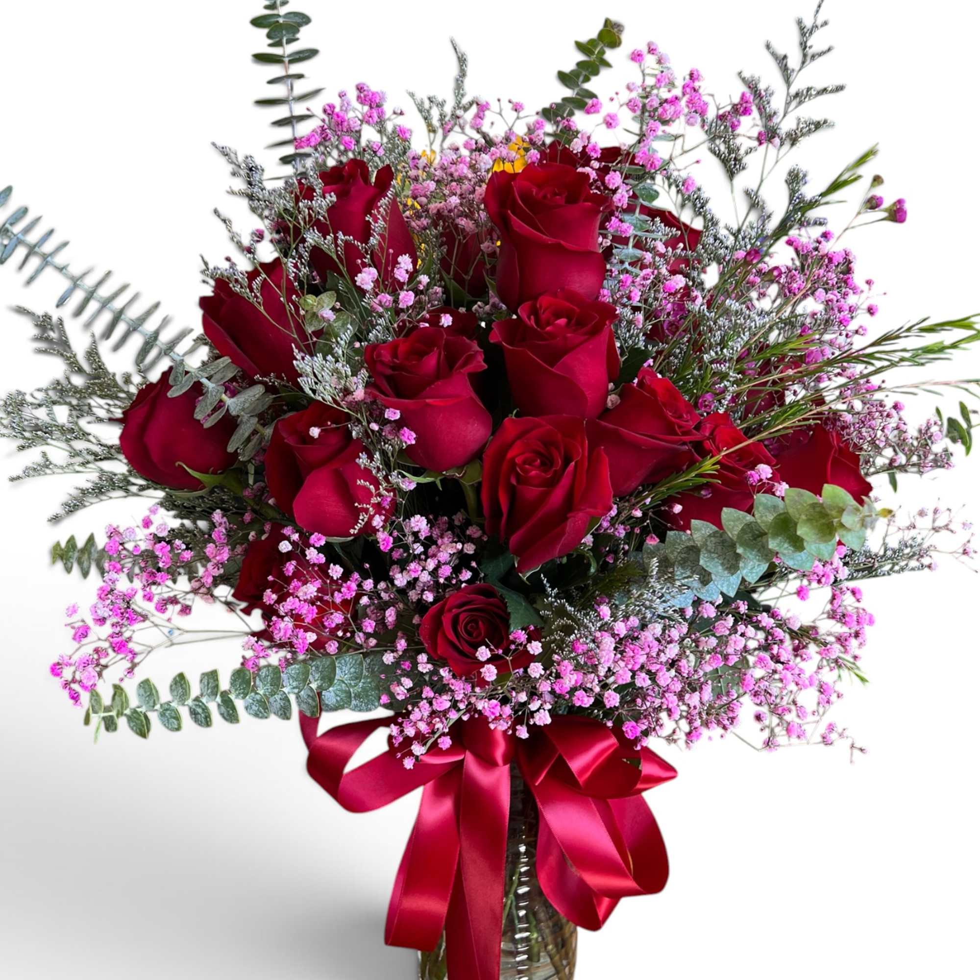Red roses in a glass vase with pink filler flowers and a red ribbon, photo 3 of 3