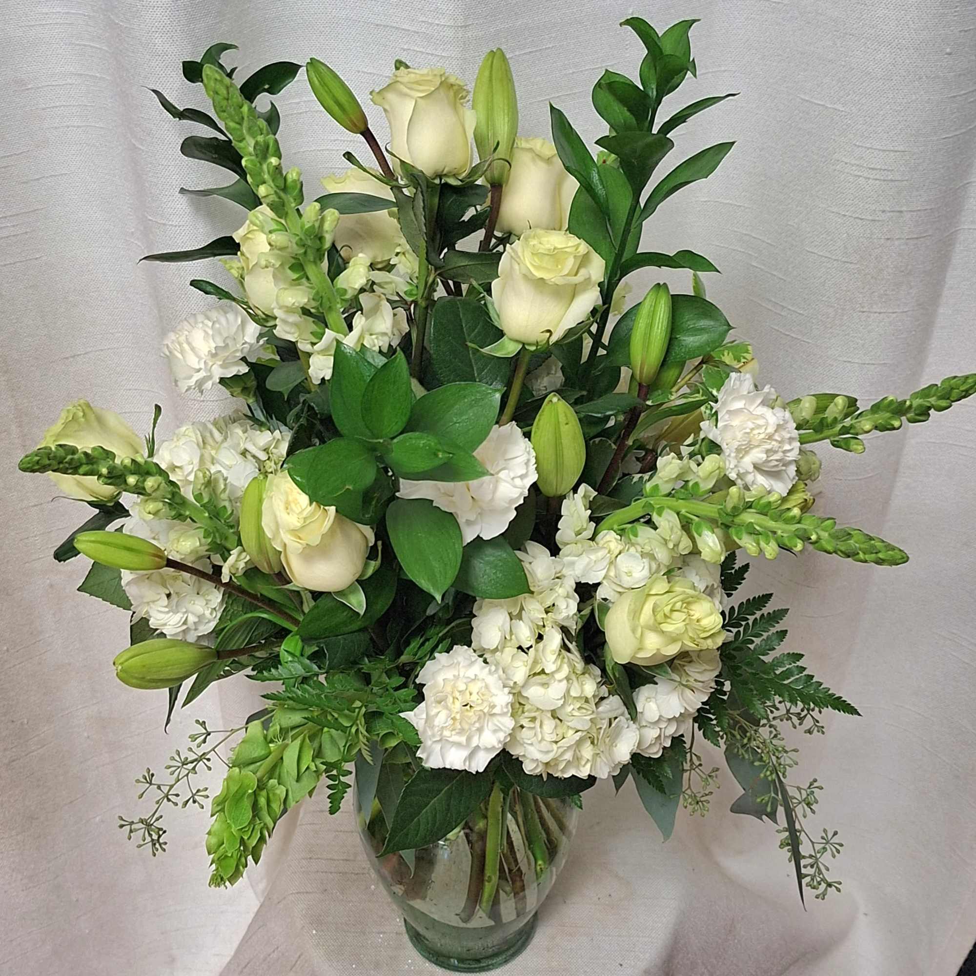 Create an elegant and tranquil atmosphere with our all-white funeral arrangement, featuring, photo 2 of 2