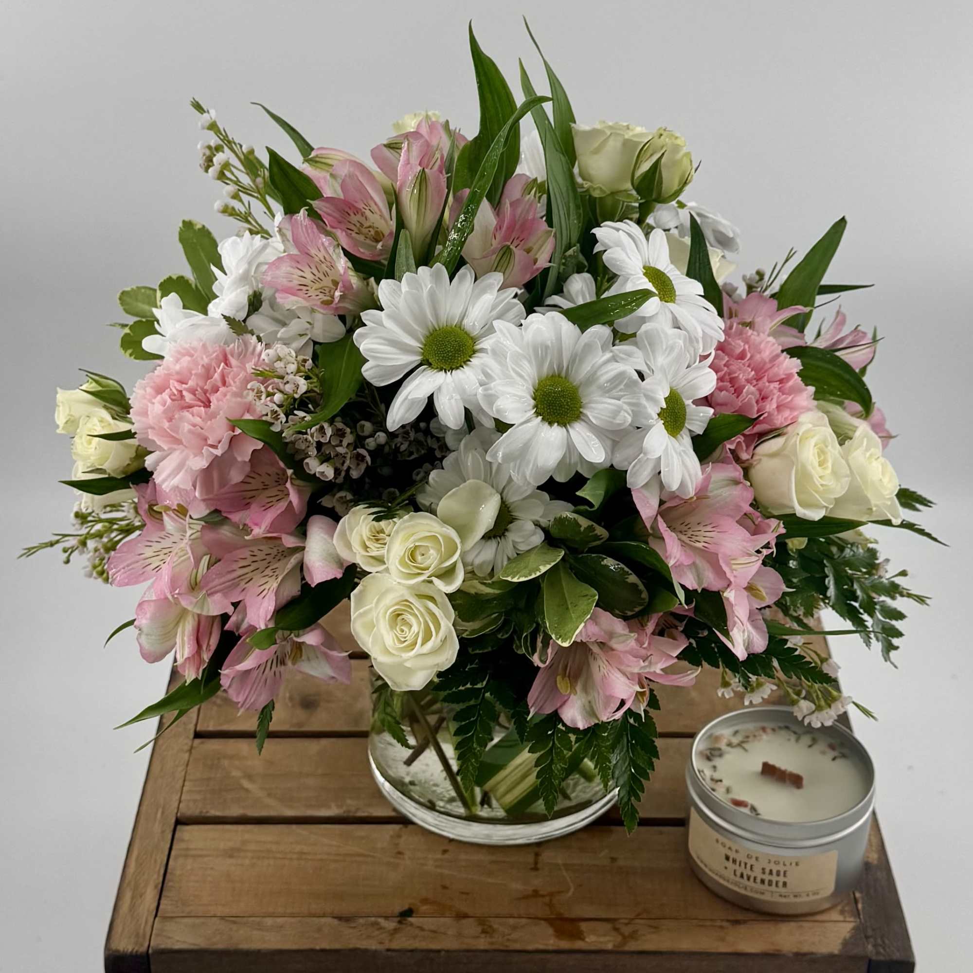 Delight in this charming blend of white daisies, pink alstroemeria, spray roses