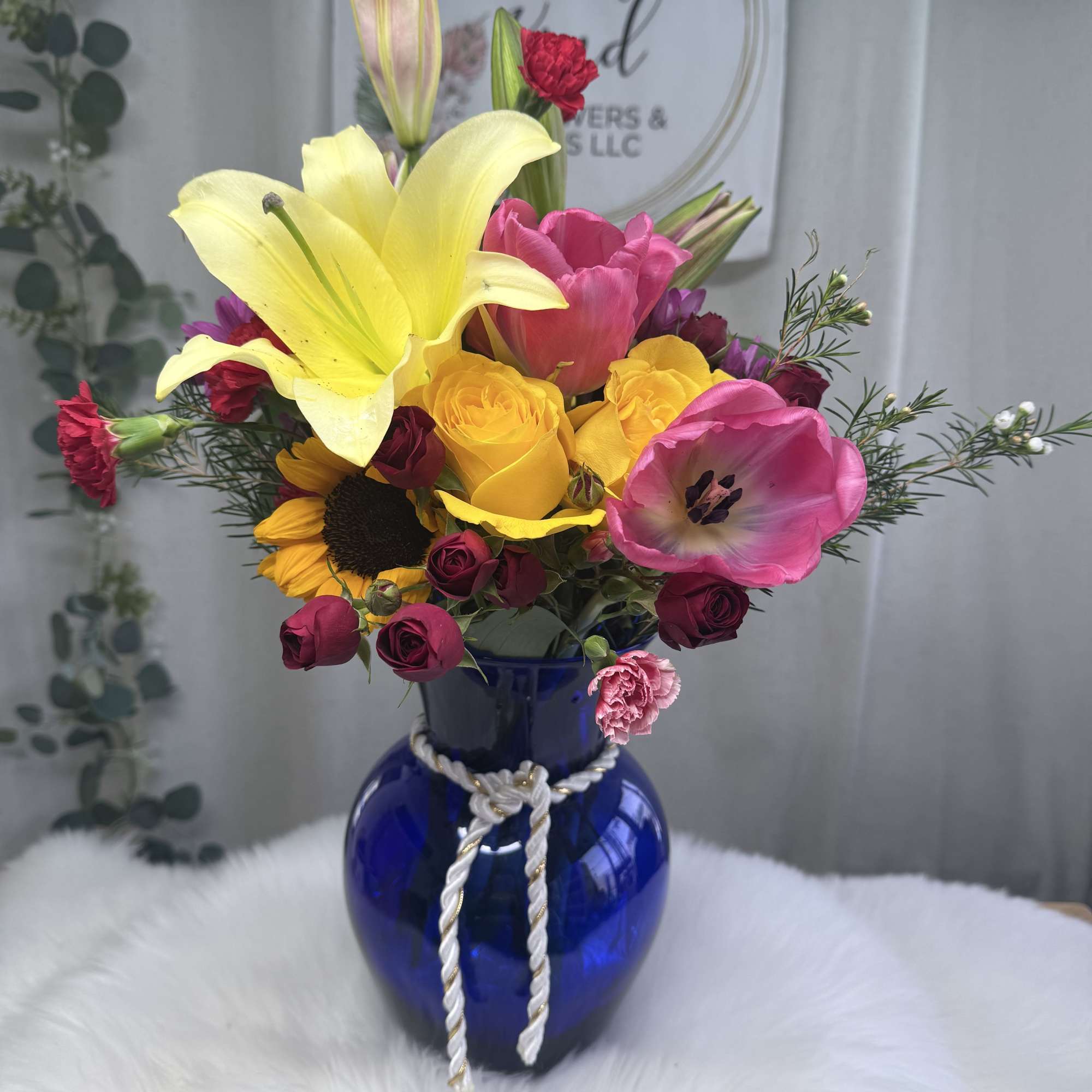 A lively and elegant floral arrangement bursting with seasonal color and charm., photo 2 of 2