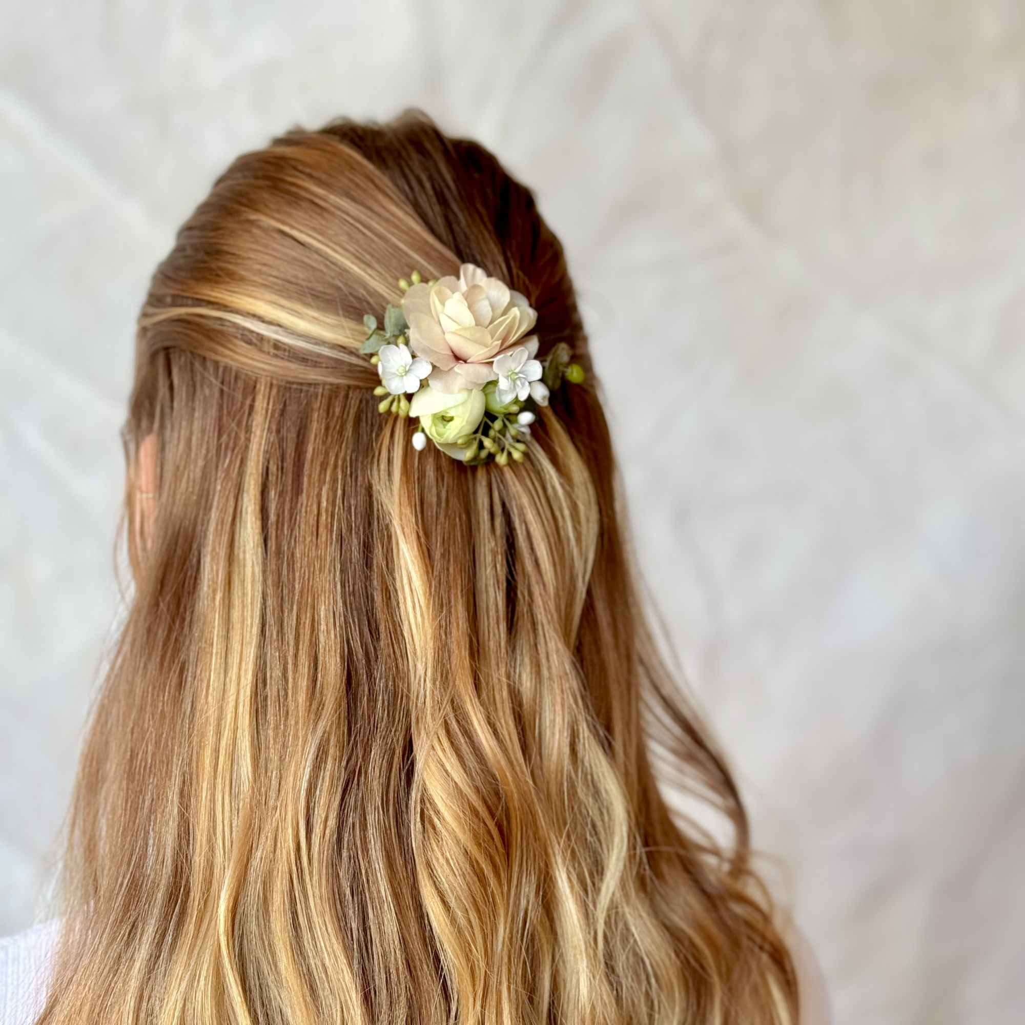 Blonde hair with a small floral hair clip