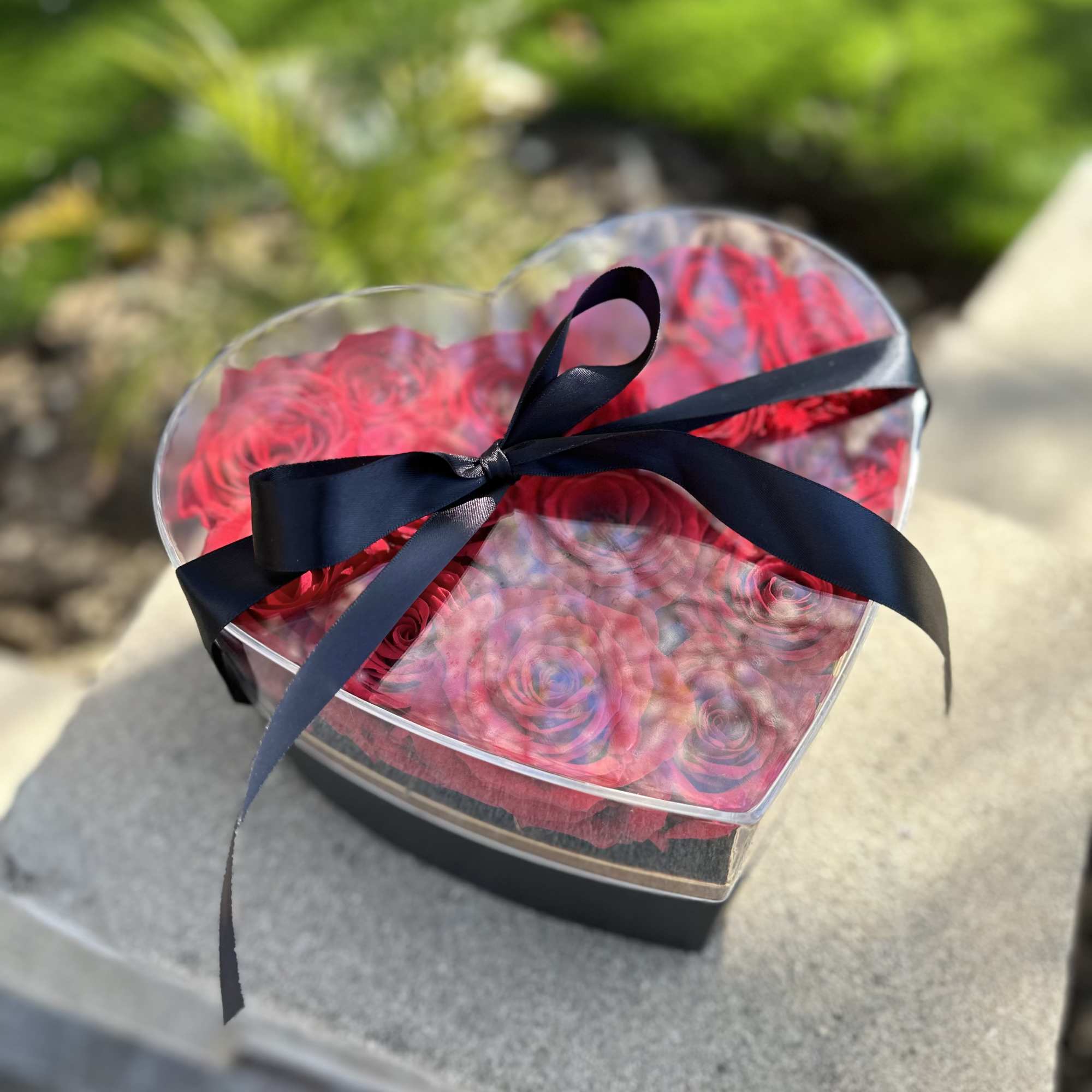 Heart-shaped box of red roses with a black ribbon, photo 3 of 3