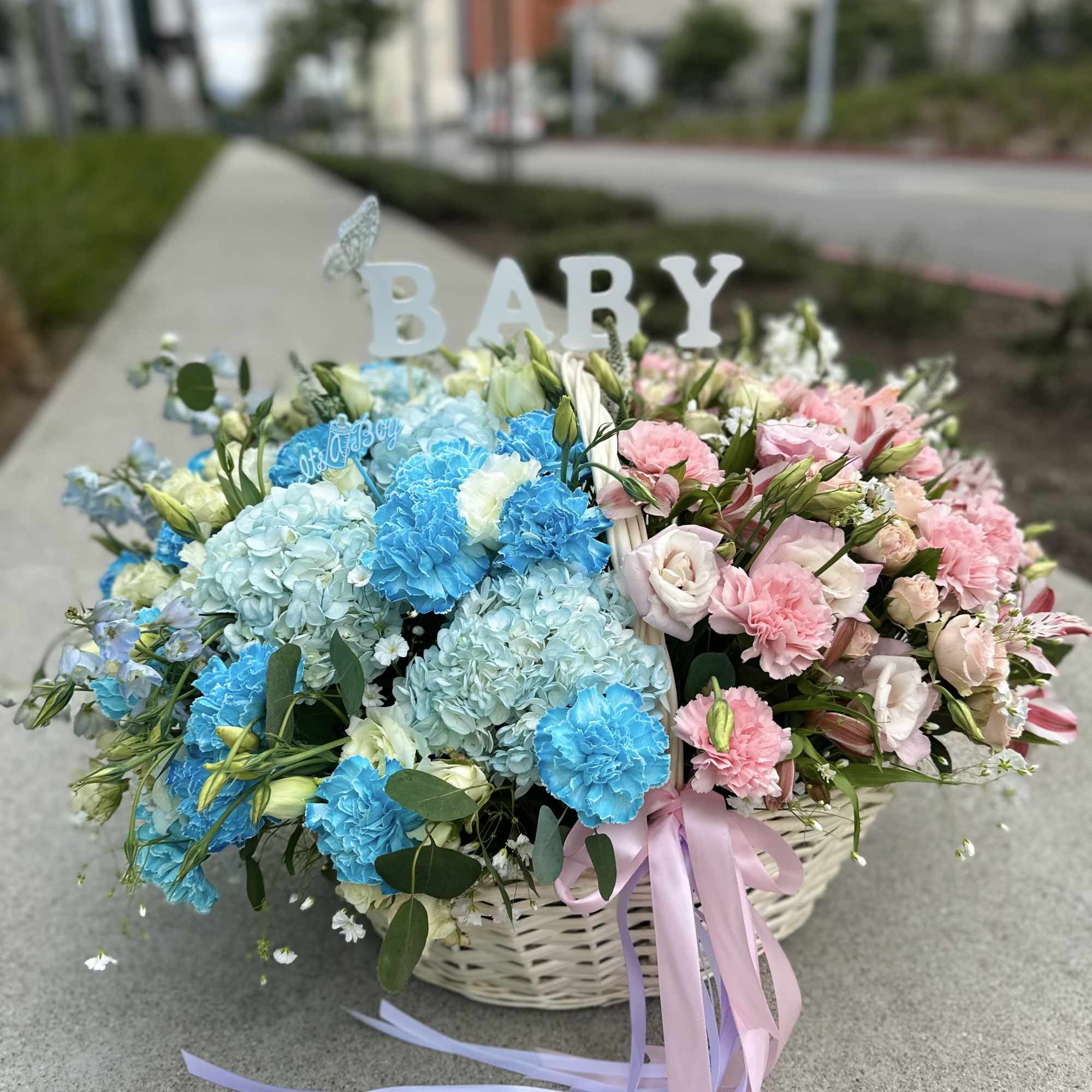 Basket arrangement of blue and pink flowers with a BABY sign, photo 4 of 4