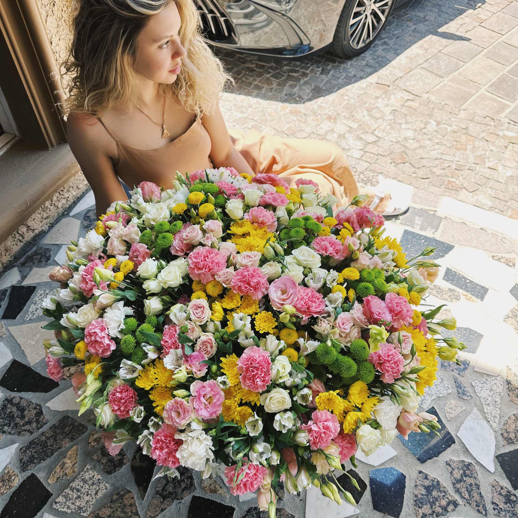 Large mixed bouquet of pink, white, and yellow flowers