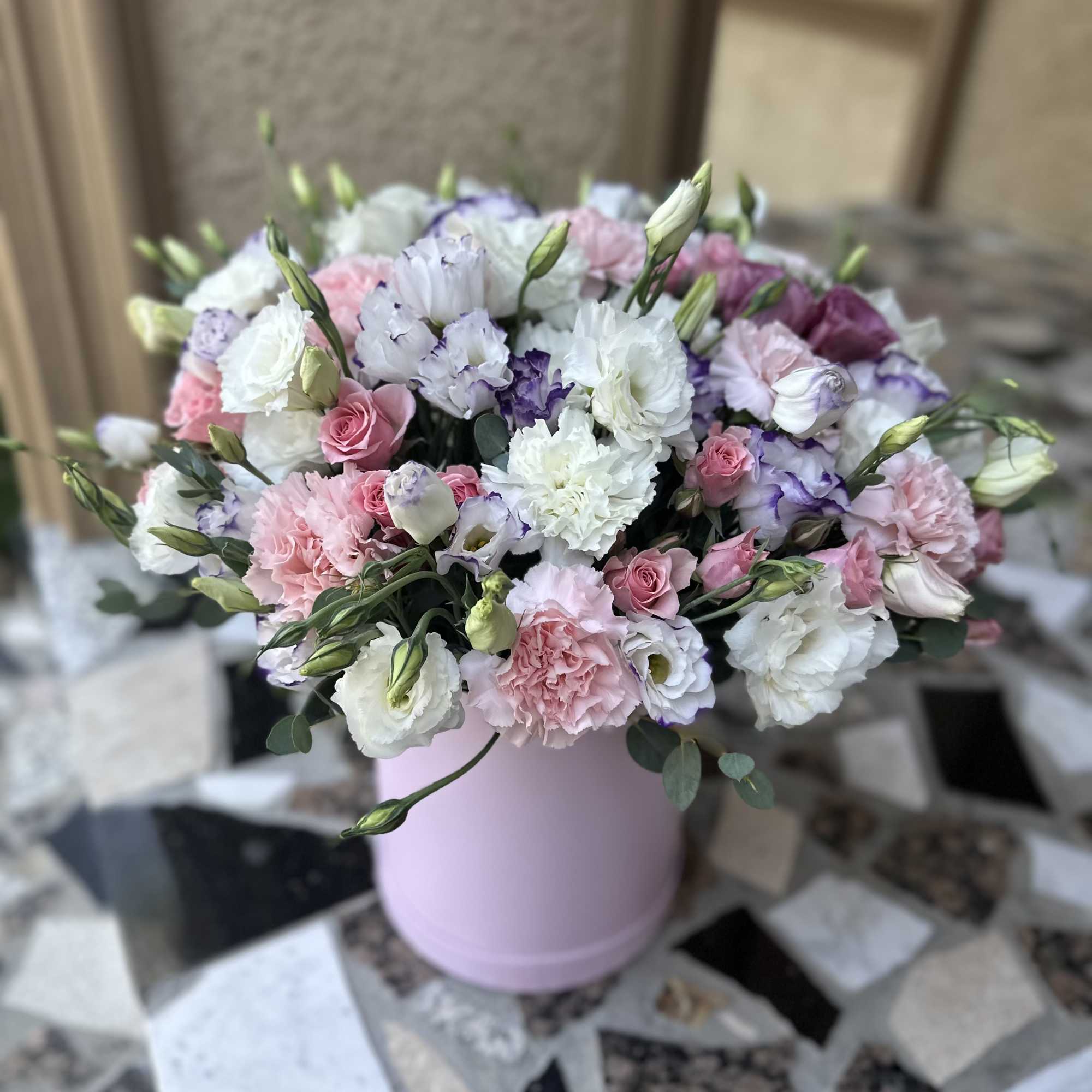 Pink and white bouquet in a pastel pink hat box