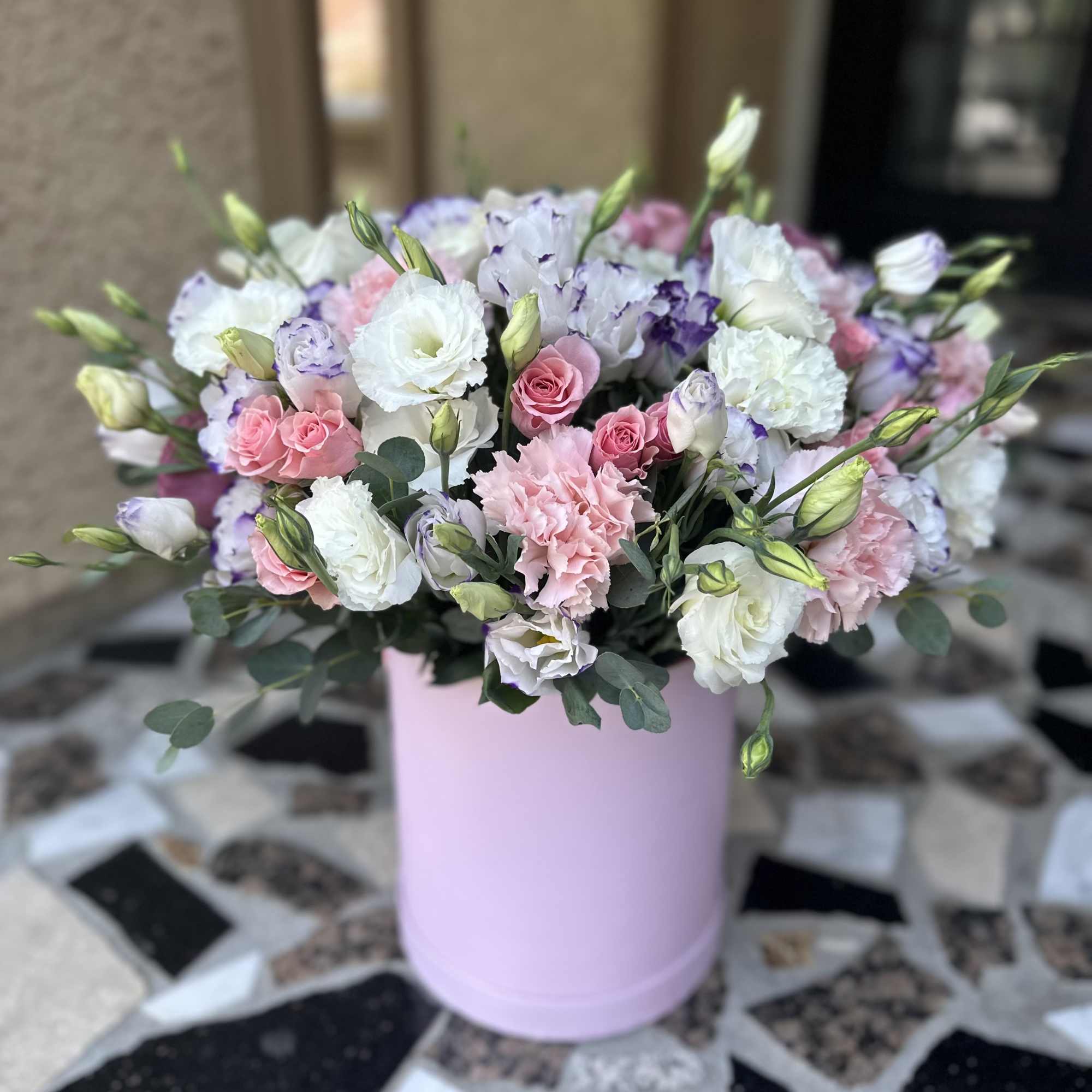 Pink and white mixed bouquet in a pastel pink box