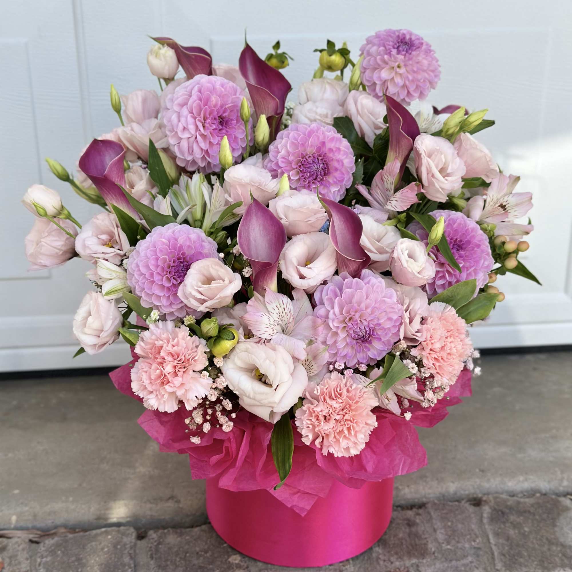 Pink and lavender mixed bouquet in a bright pink box