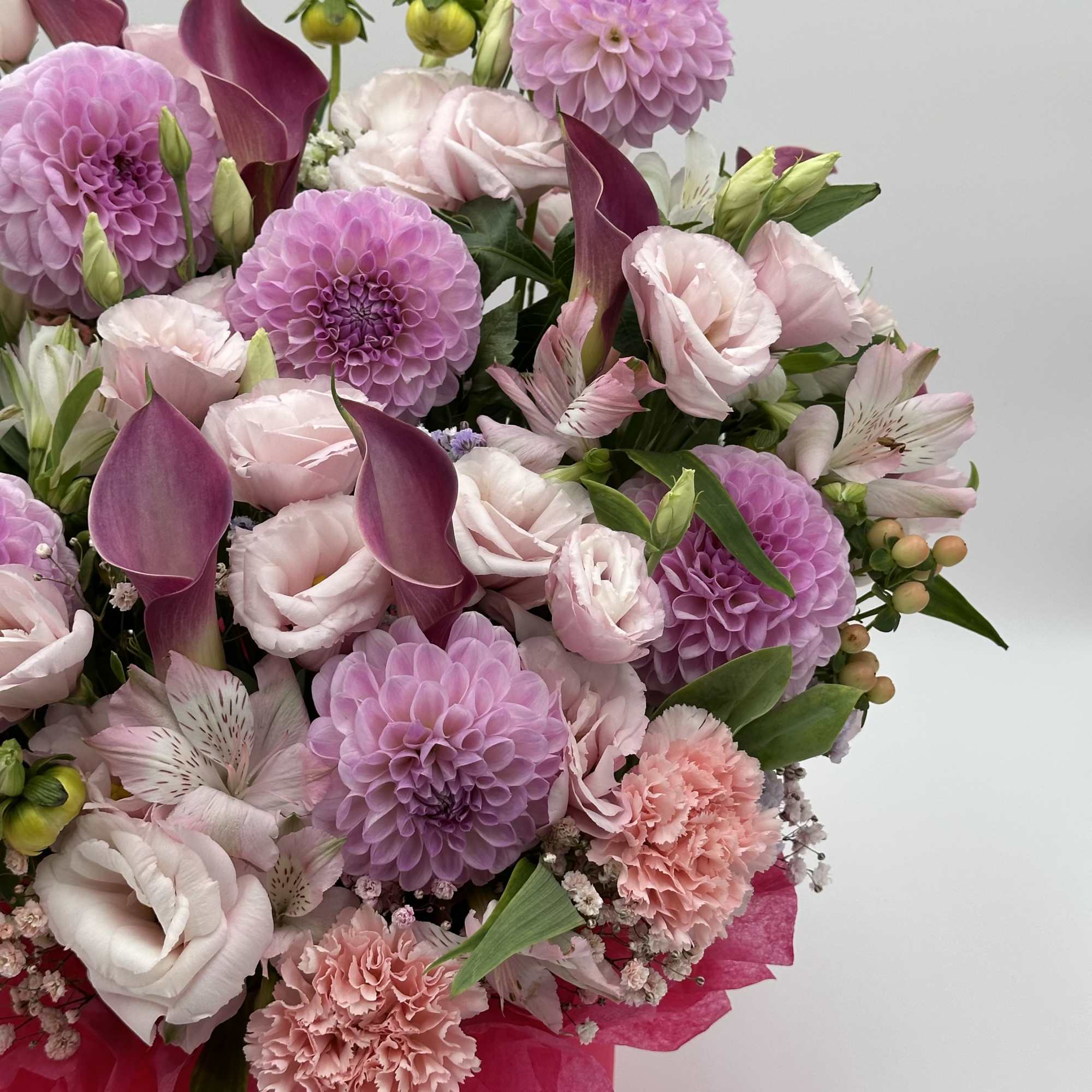 Pink and lavender bouquet with calla lilies, dahlias, and carnations