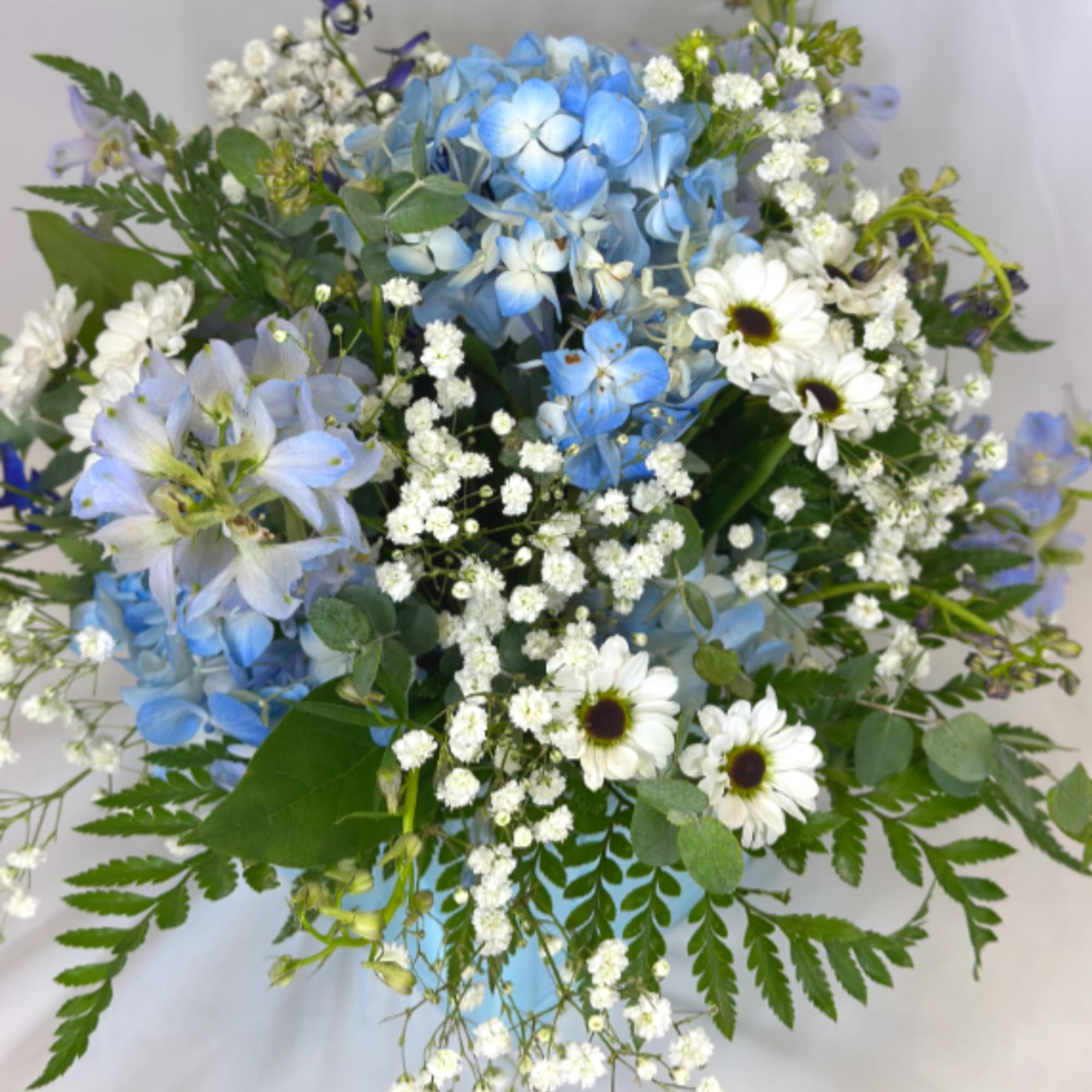 Baby blue flowers are perfect for so many occasions! This special arrangement
