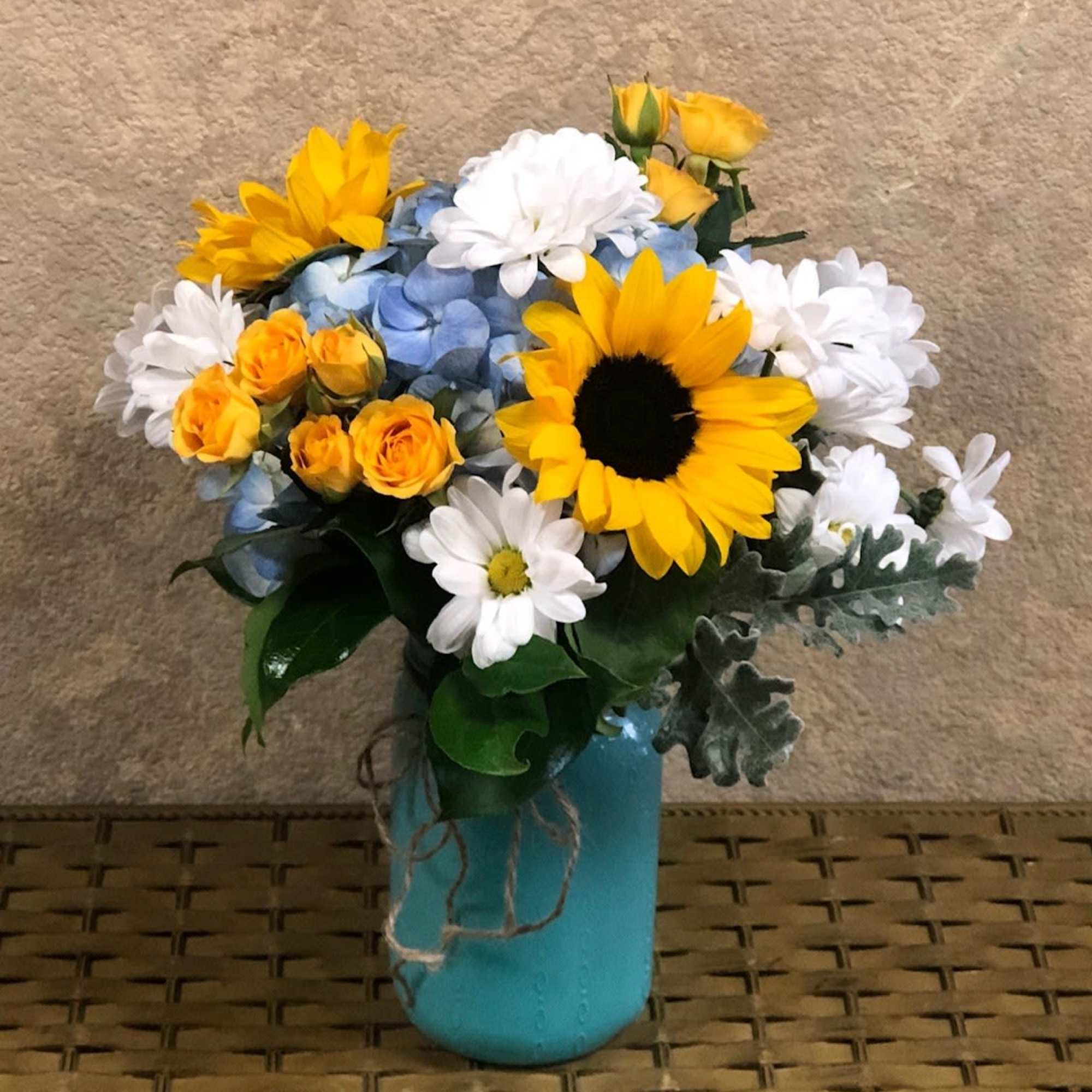 Type of Flowers: Sunflowers, Blue Hydrangeas, White Daisies, Yellow Spray Roses, and, photo 2 of 2