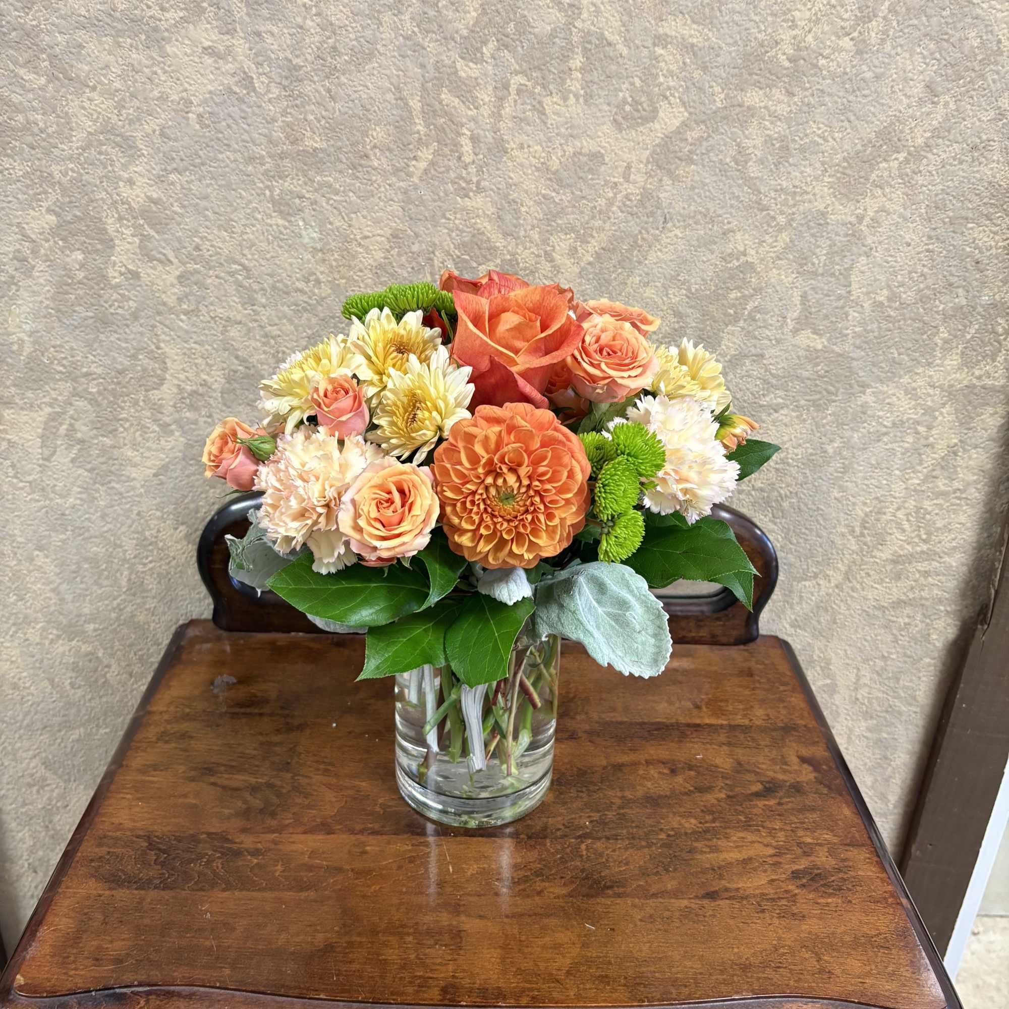 Recipe: Seasonal dahlias, spray roses, orange roses, carnations, chrysanthemums, and dusty miller, photo 2 of 2
