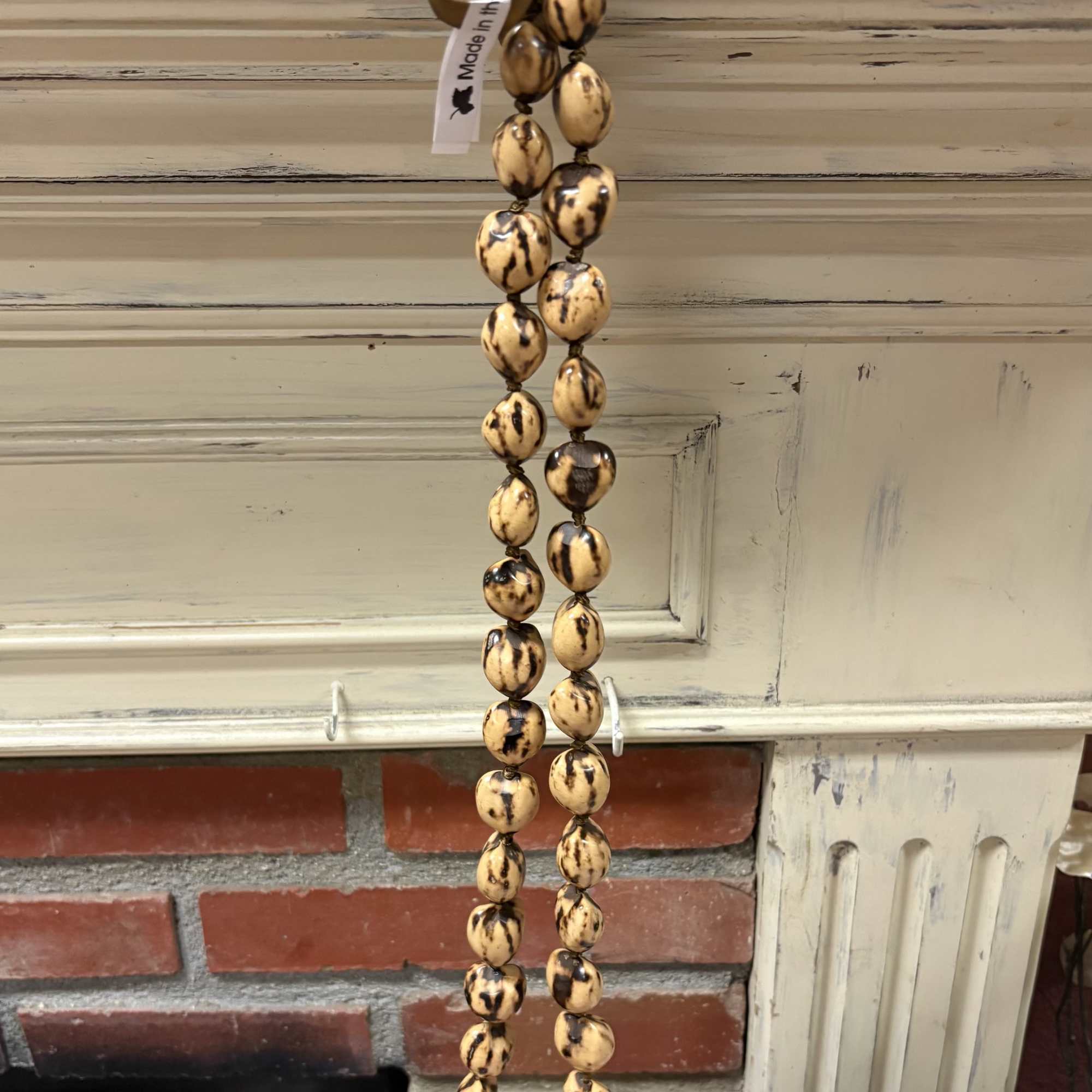 Orange and Black Kukui Nut Lei
Made in the Phillipines, photo 2 of 2