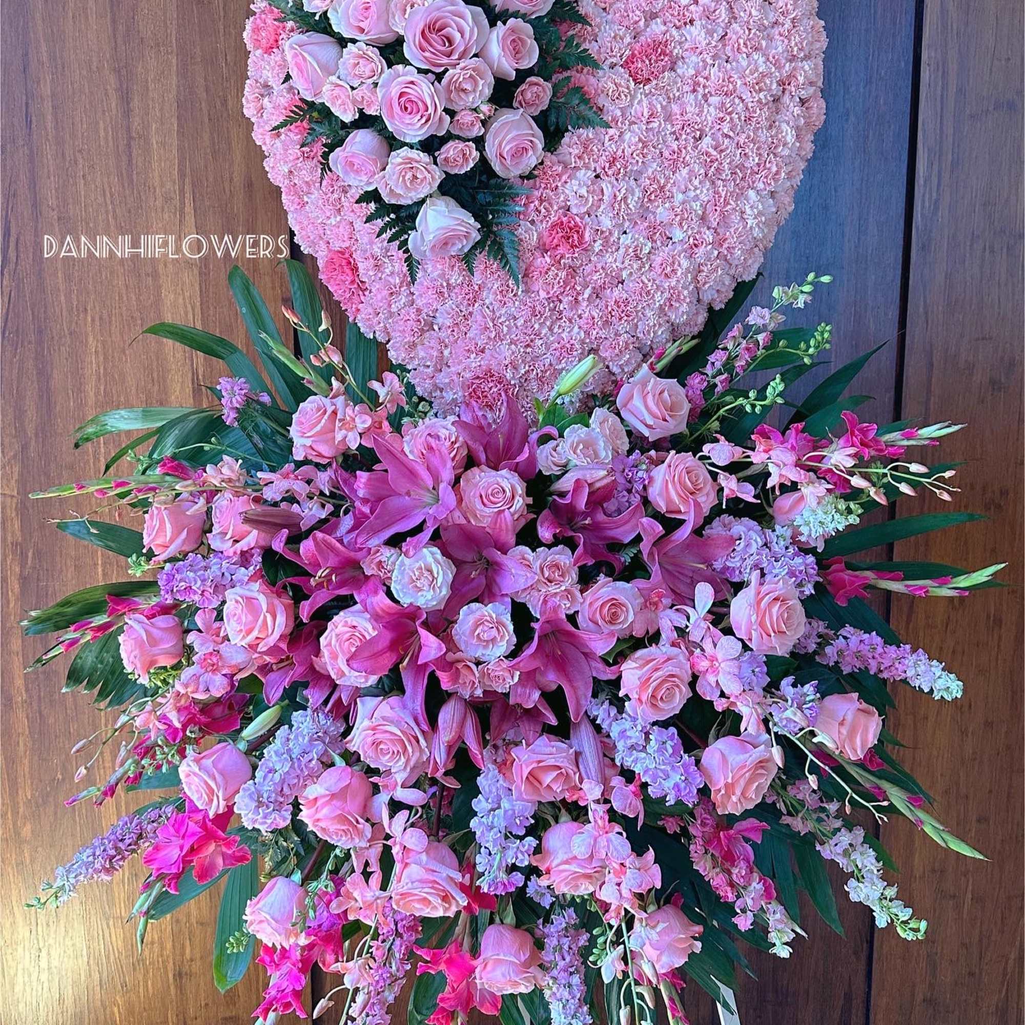 Large pink floral heart and standing spray with roses and lilies