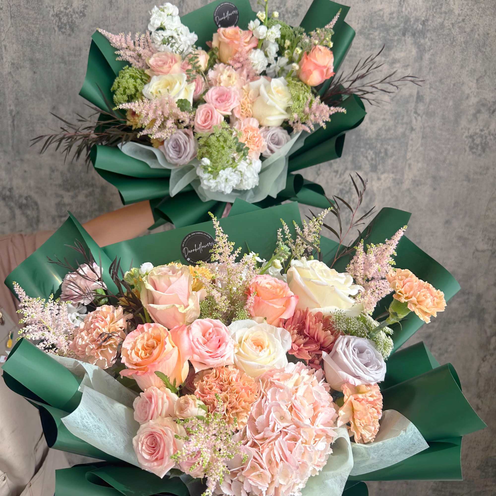 The bouquet features  a soft, romantic color palette, wrapped in rich, photo 3 of 3