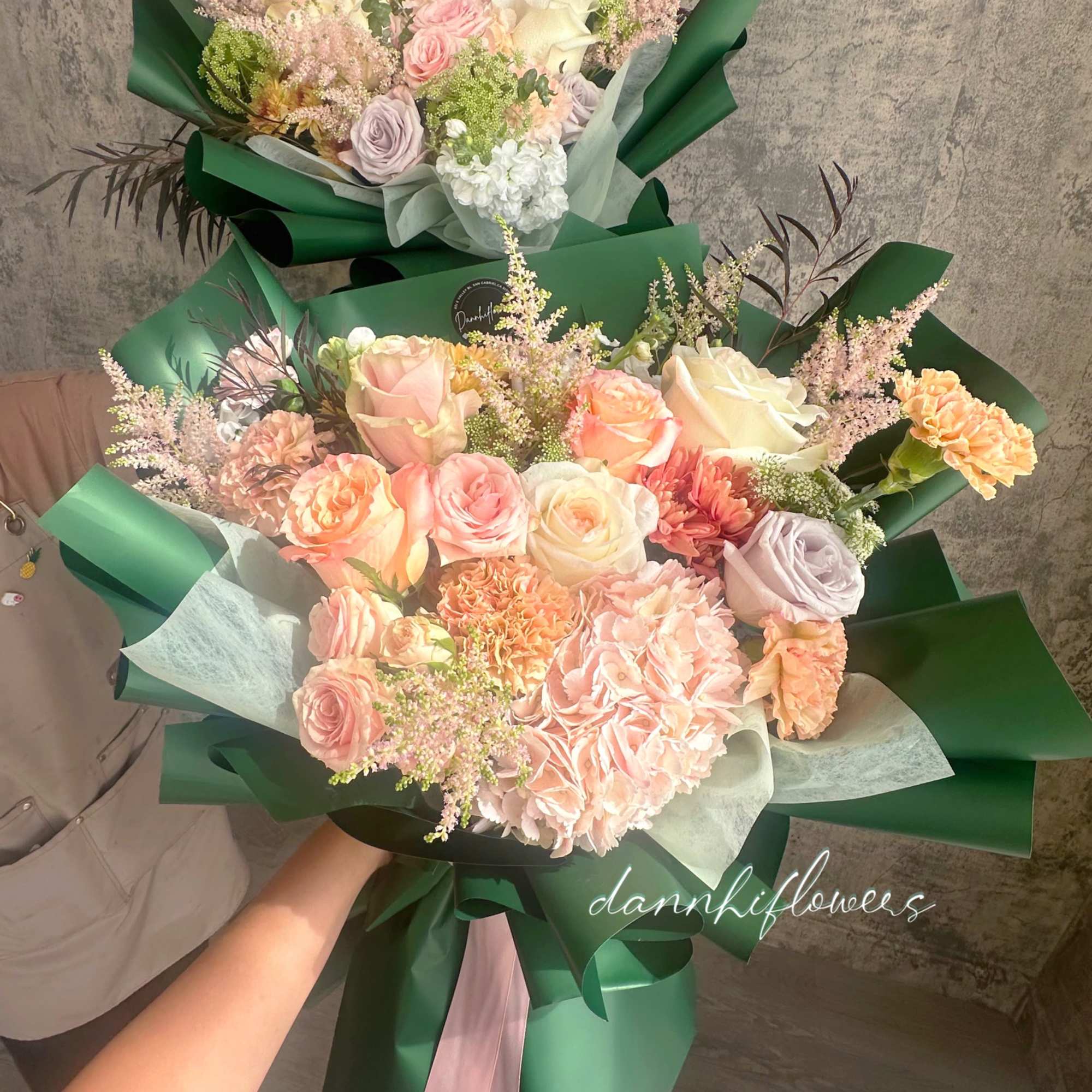 The bouquet features  a soft, romantic color palette, wrapped in rich, photo 2 of 2