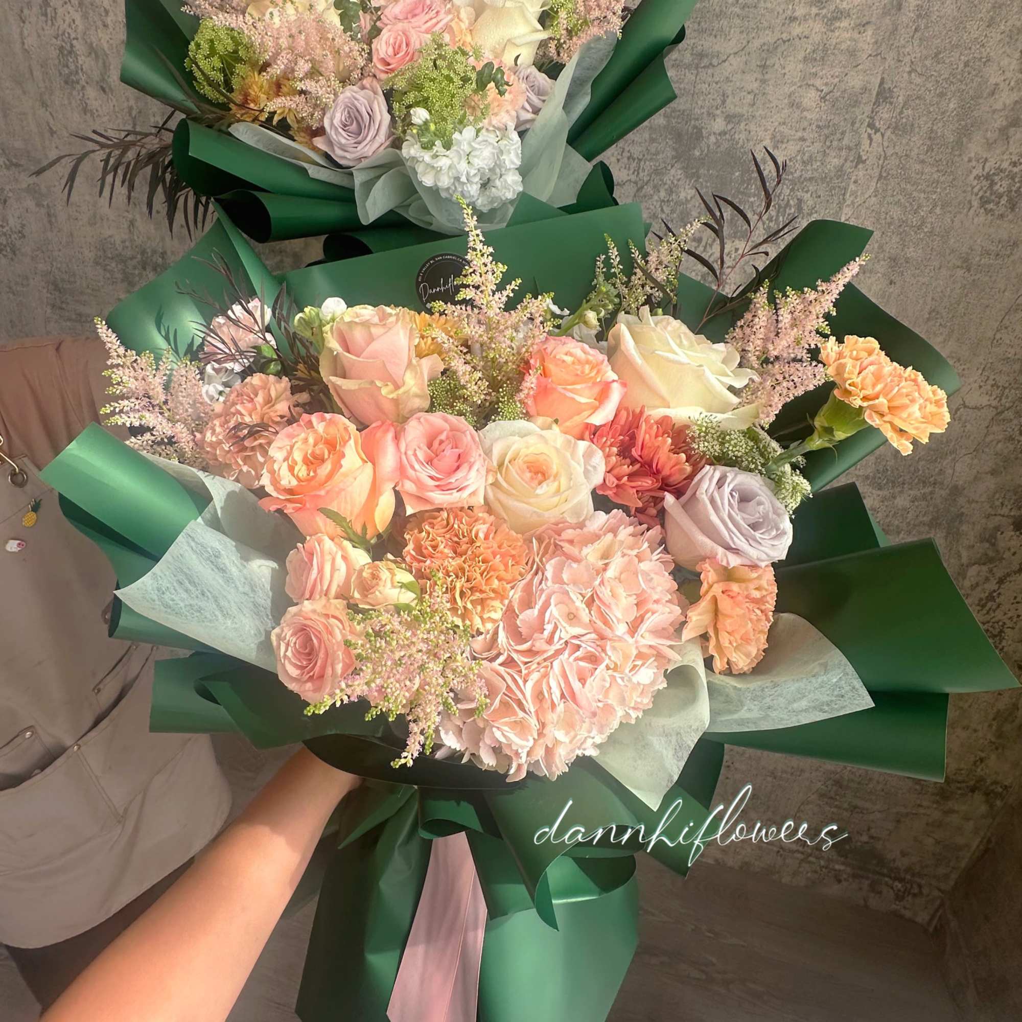 The bouquet features  a soft, romantic color palette, wrapped in rich, photo 2 of 2