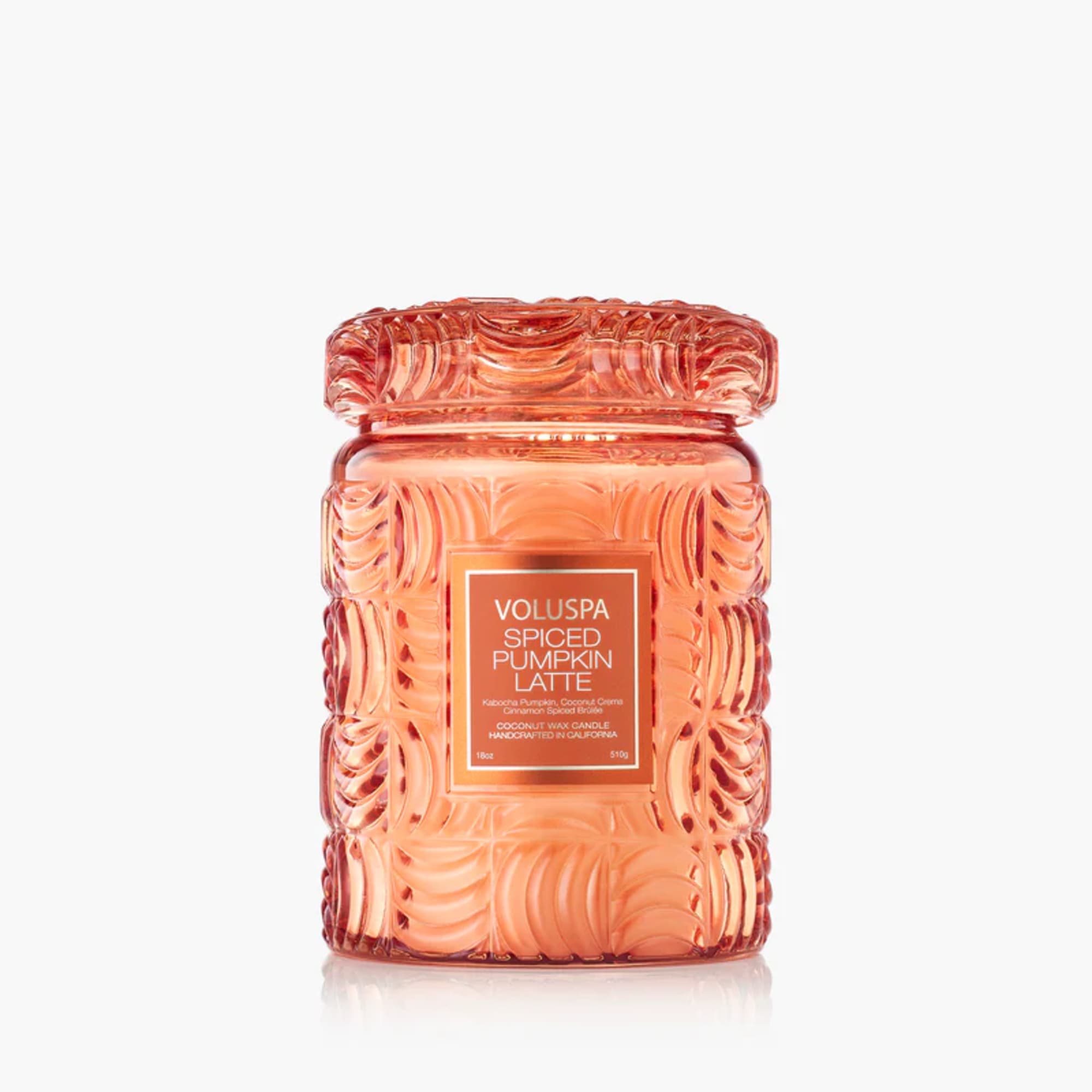 Orange glass candle jar with a matching lid