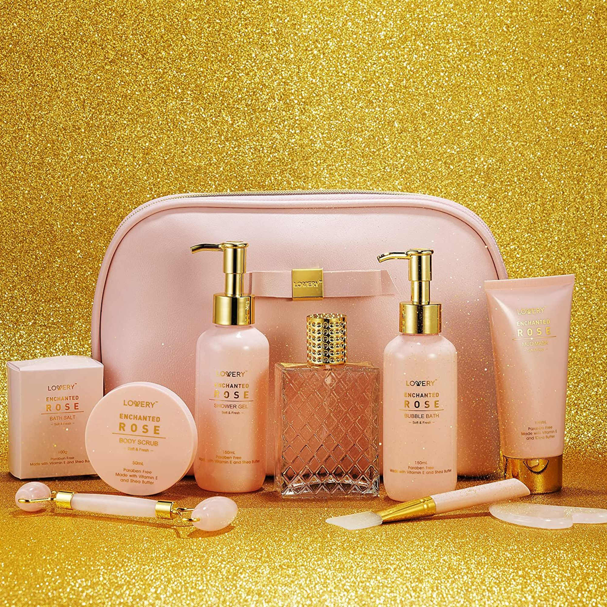 Pink rose bath and body gift set with cosmetic bag on a gold glitter background