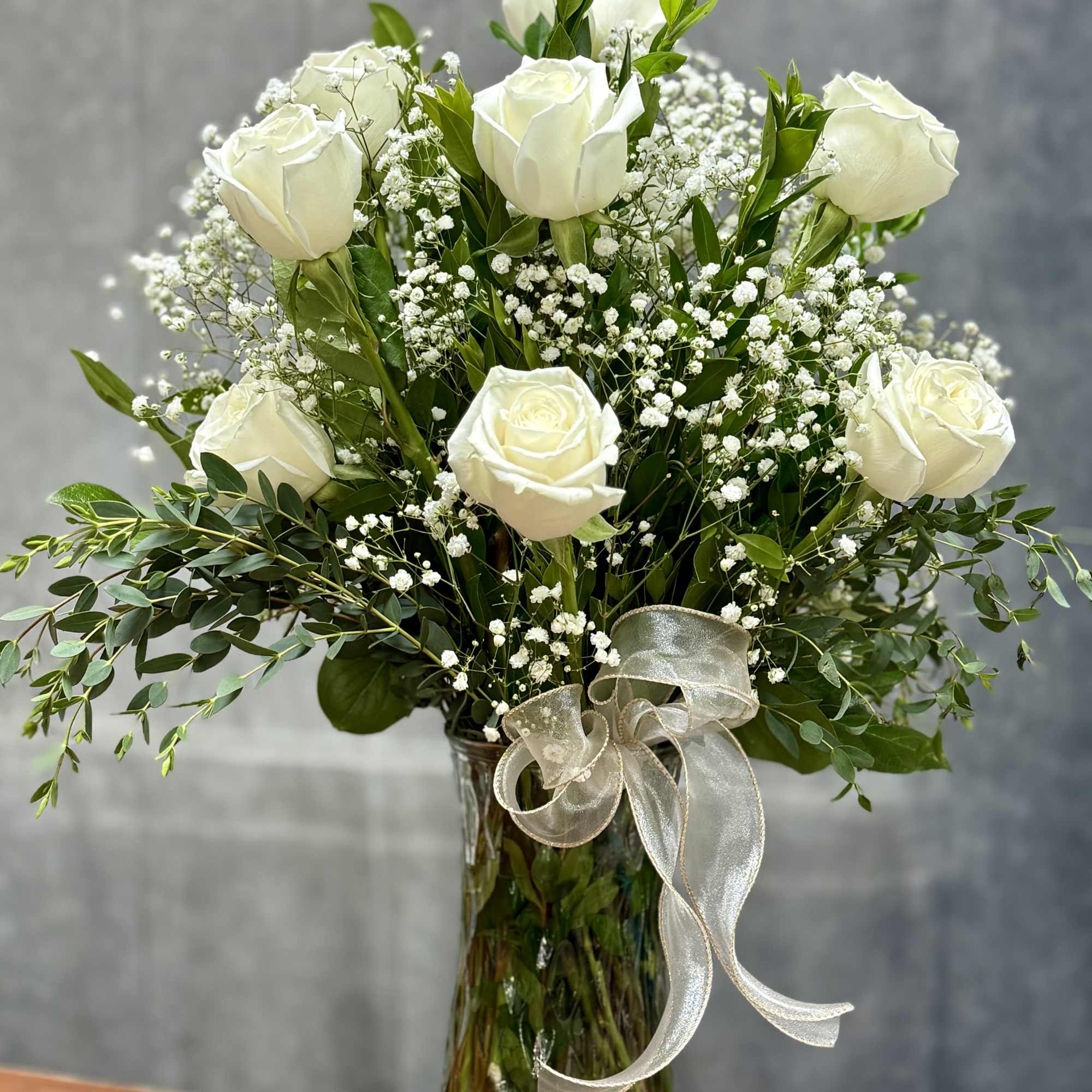 Classic White Roses 
A Timeless arrangement of white roses, accented with baby&rsquo;s, photo 2 of 2