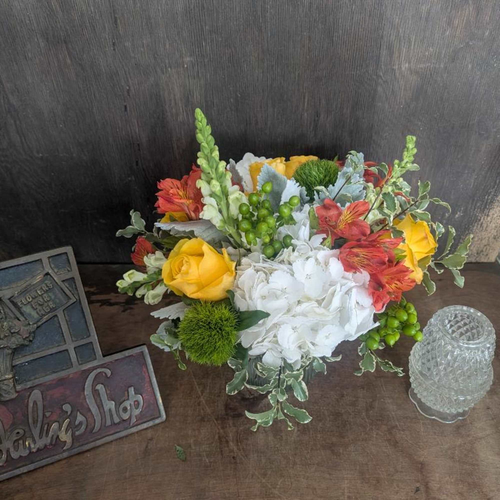 A bright cluster of white hydrangeas paired with sunny yellow roses and, photo 2 of 2