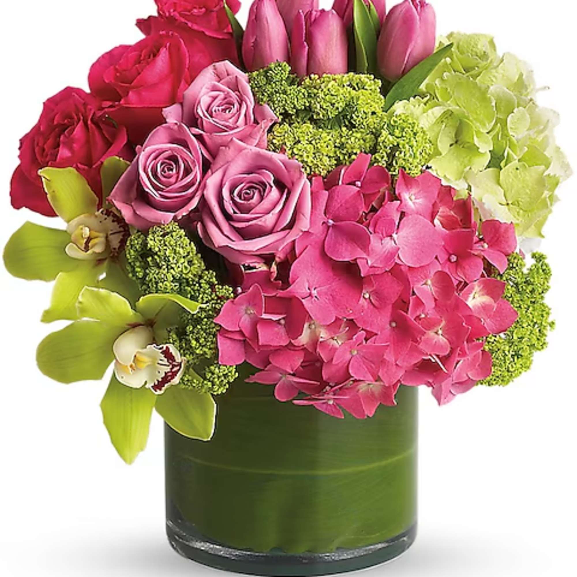 Pink roses, tulips, and hydrangeas in a green glass vase