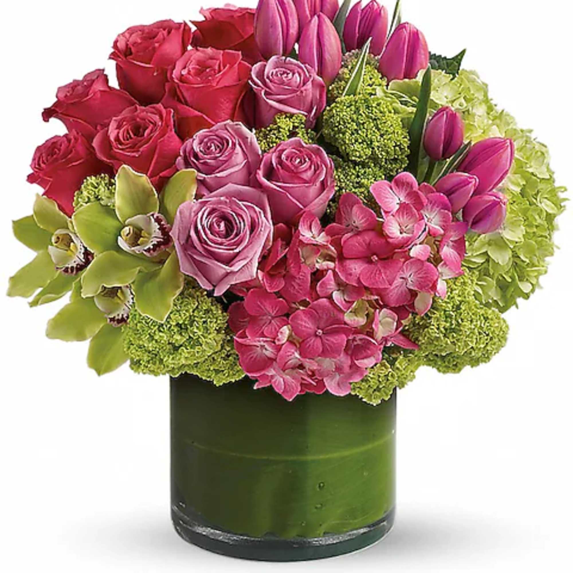Pink roses and tulips in a green glass vase with green hydrangea