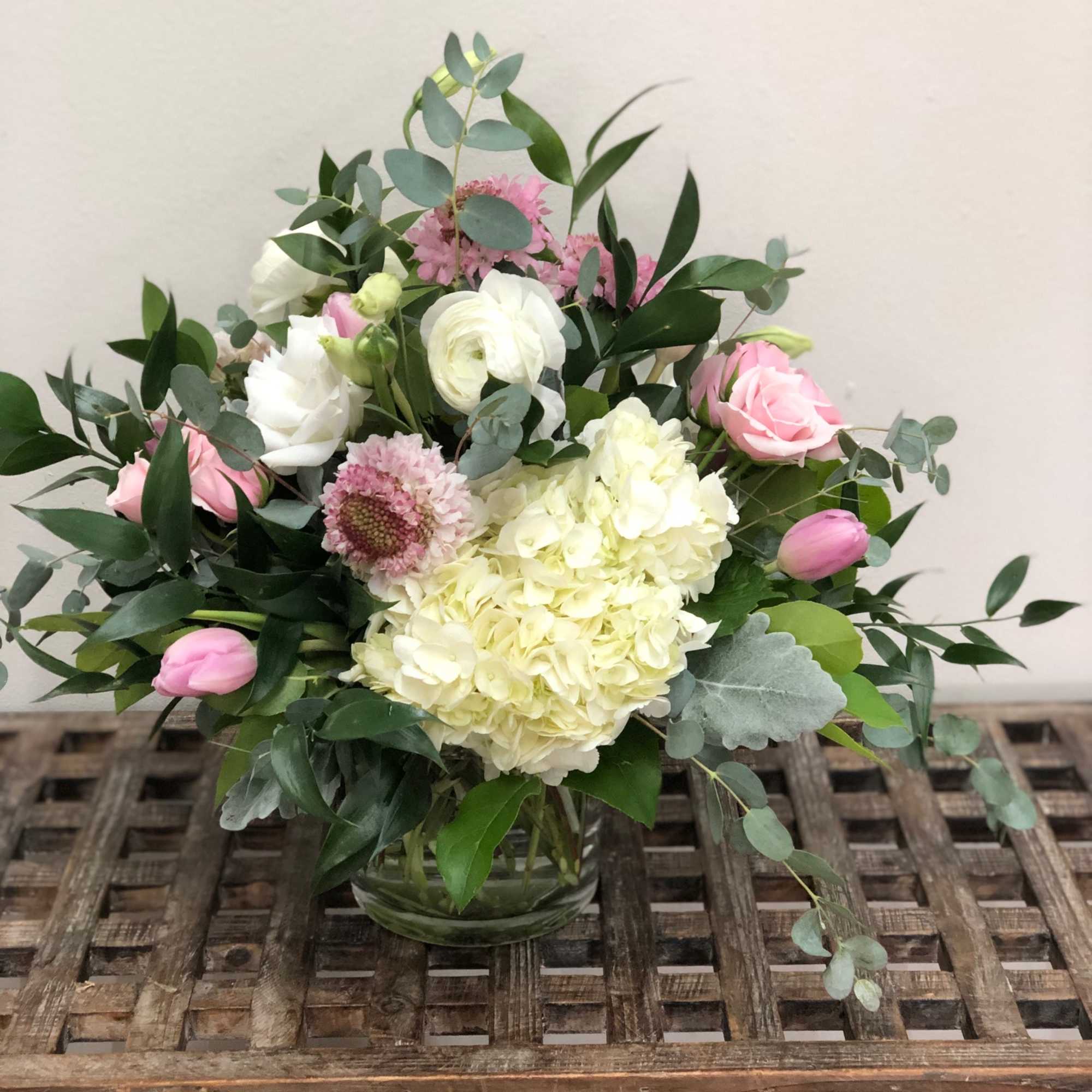 Pink and white bouquet in a glass vase